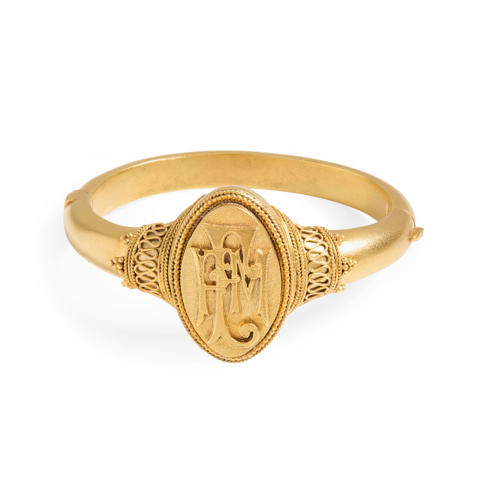 John Brogden: A 19th century silver-gilt bangle, 1880: John Brogden: A 19th century silver-gilt bangle, 1880 Of hinged design, the central panel with applied initials EFM, wirework and beaded detail to the tapering shoulders, UK hallmark; in a fitted box
