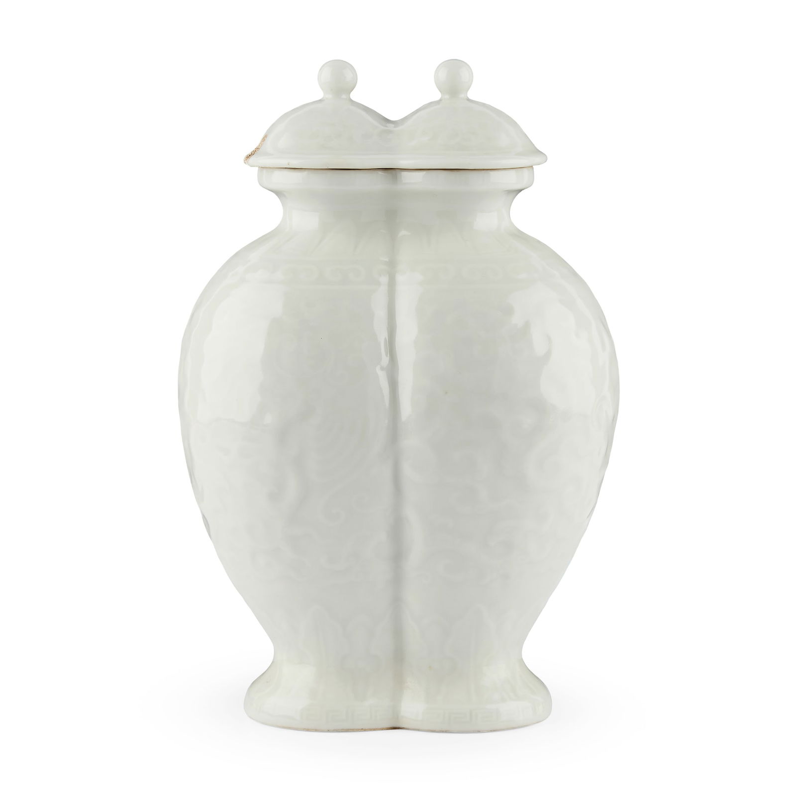 CHINESE WHITE-GLAZED AND MOULDED 'PHOENIX' CONJOINED VASE WITH COVER: CHINESE WHITE-GLAZED AND MOULDED 'PHOENIX' CONJOINED VASE WITH COVER QIANLONG MARK 乾隆款 白釉模印龍鳳紋雙連蓋瓶the