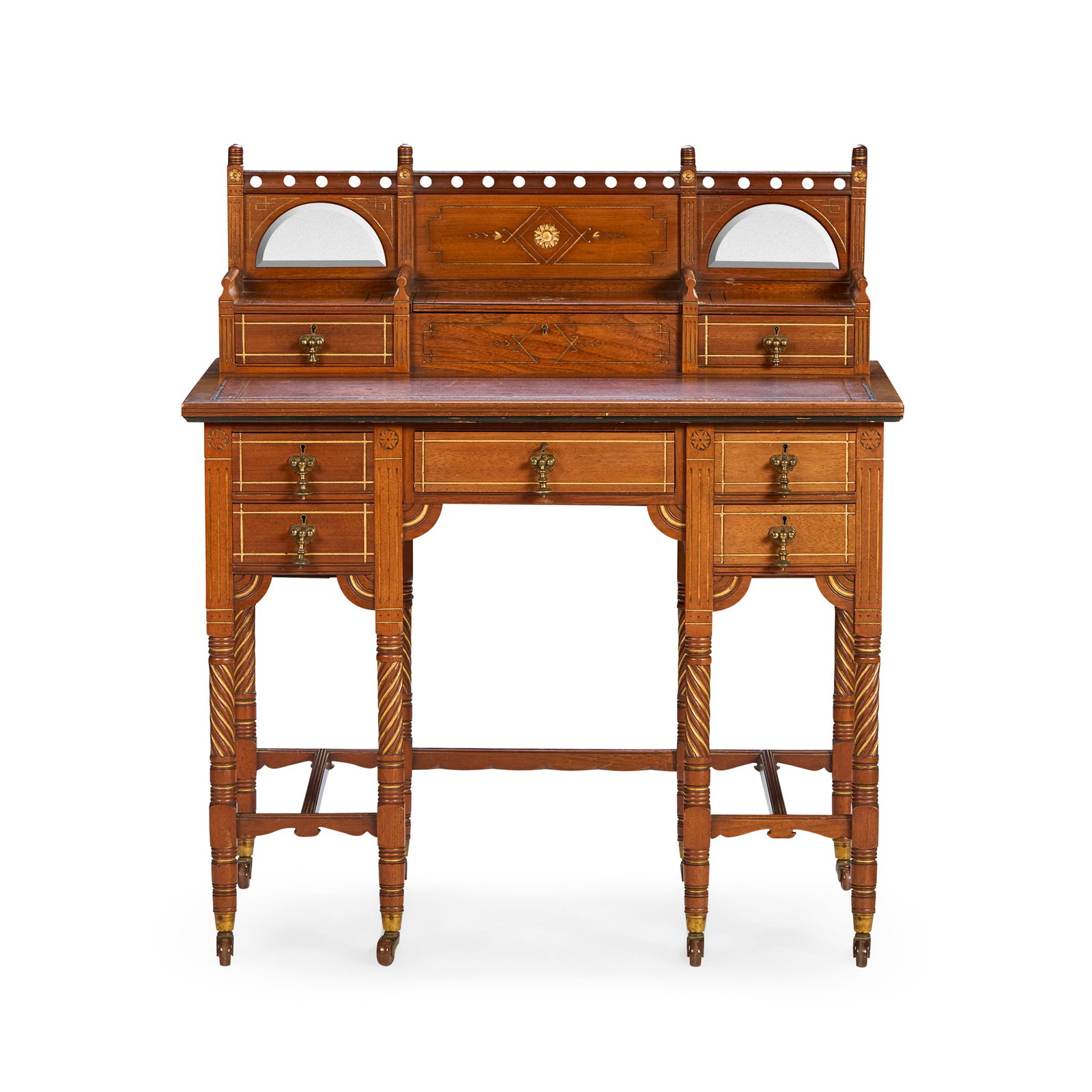 ENGLISH: ENGLISH AESTHETIC MOVEMENT LADY'S DESK, CIRCA 1875 walnut, with mirrored panels, incised gilded decoration, leather writing surface and brass fittings 91.5cm wide, 103cm high, 56cm deep