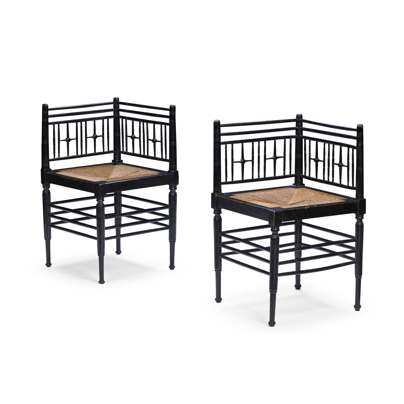 ATTRIBUTED TO FORD MADOX BROWN (1821-1893) FOR MORRIS & COMPANY: ATTRIBUTED TO FORD MADOX BROWN (1821-1893) FOR MORRIS & COMPANY TWO ARTS AND CRAFTS ‘SUSSEX’ CORNER ARMCHAIRS, CIRCA 1875 ebonised wood with drop-in seat (2) 42cm square, 71cm high