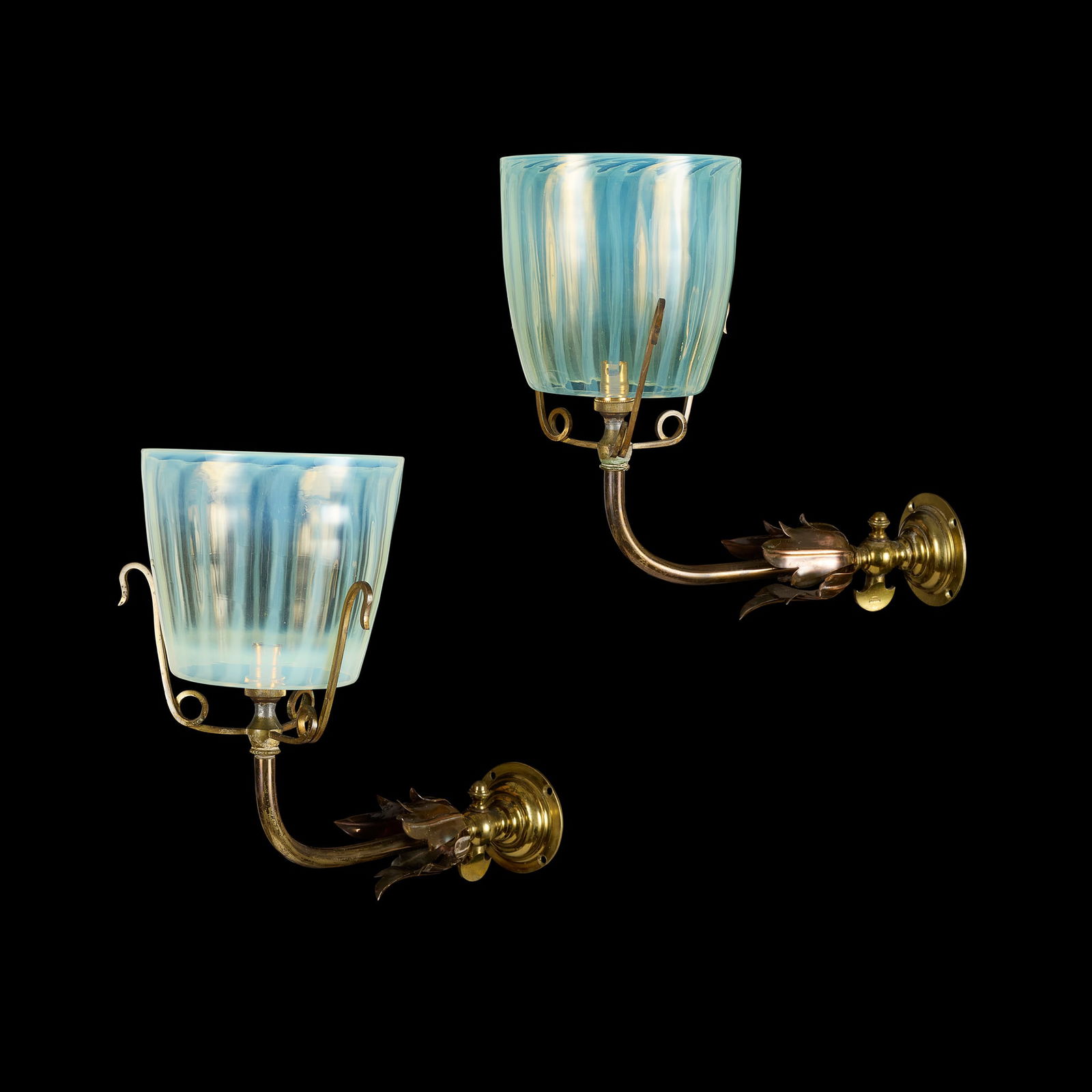W.A.S. BENSON (1854-1924): W.A.S. BENSON (1854-1924) PAIR OF WALL SCONCES, CIRCA 1900 brass, copper, opalescent glass, stamped W.A.S. BENSON (2) 30cm deep, 30cm high Literature: Hamerton I. (ed.) W. A. S. Benson: Arts and Craft