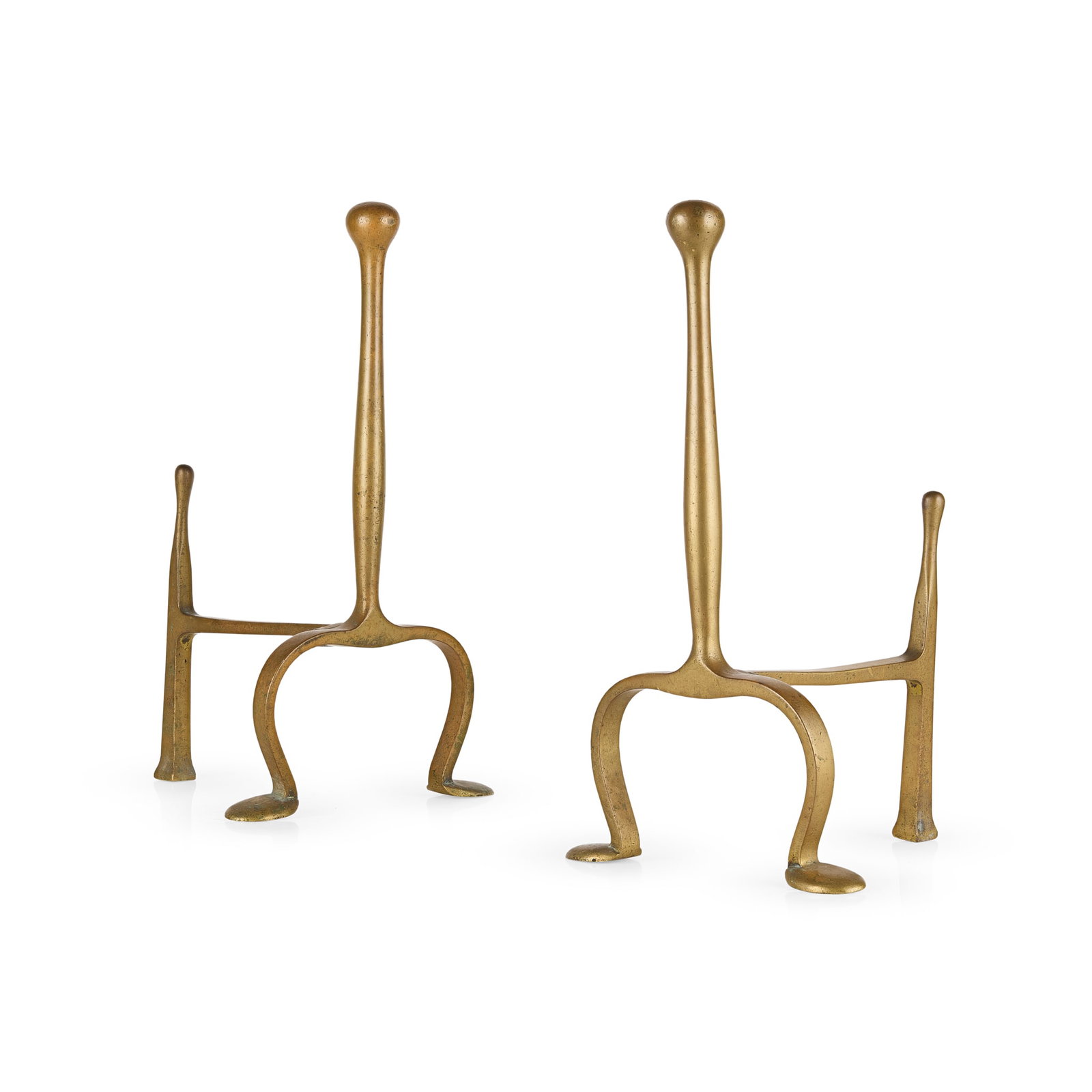 C.F.A. VOYSEY (1857-1941) FOR THOMAS ELSLEY AND CO.: C.F.A. VOYSEY (1857-1941) FOR THOMAS ELSLEY AND CO. PAIR OF ARTS & CRAFTS FIREDOGS, CIRCA 1900 brass, one stamped (twice) 15, the other stamped (twice) 21 (2) 17cm wide, 30.5cm high, 18cm deep Literat