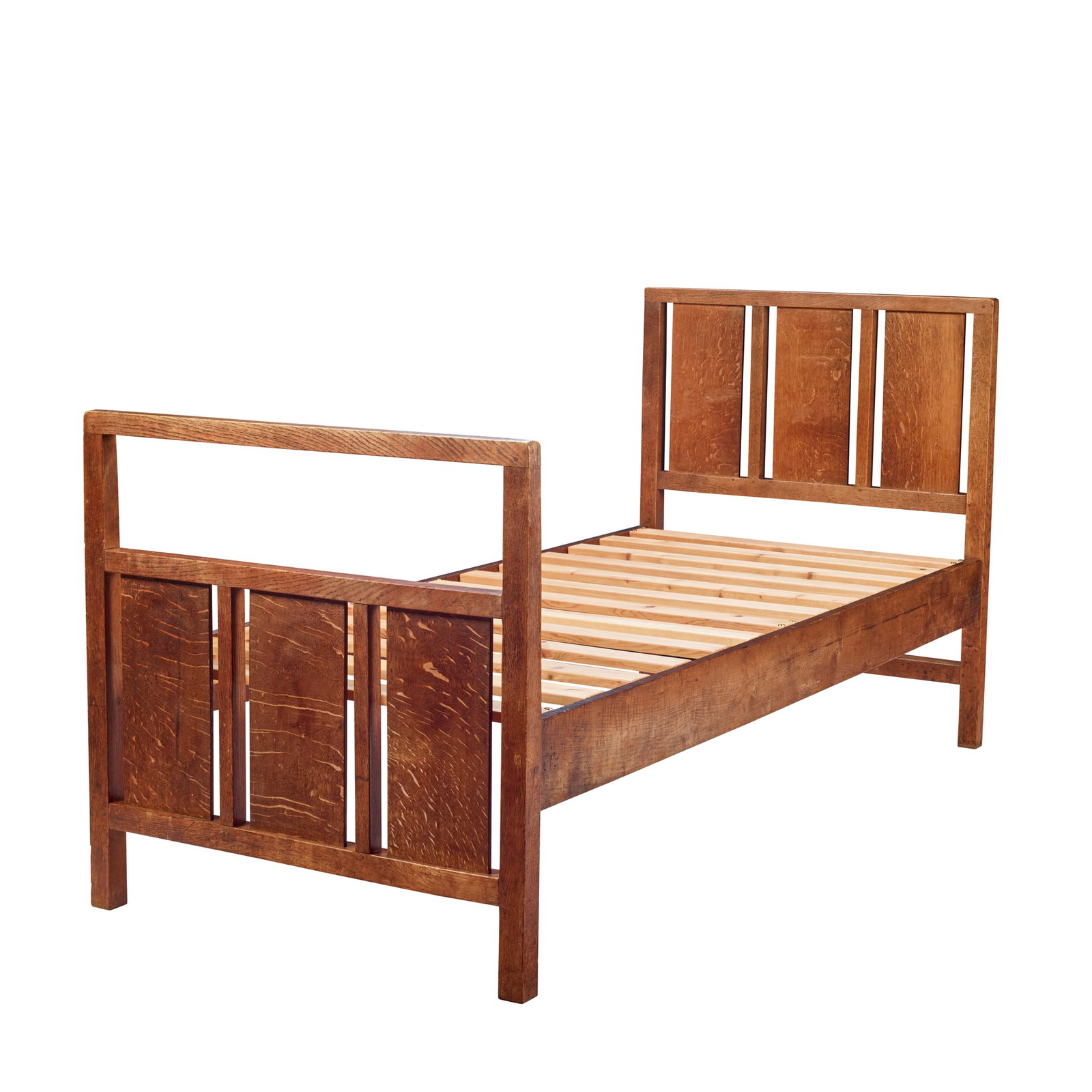 ERNEST GIMSON (1864-1919): ERNEST GIMSON (1864-1919) SINGLE BED, CIRCA 1910 oak with original side boards, later pine base and mattress 92cm wide, 107cm high, 206cm long (mattress 197cm long) Literature: Comino M. (Ed.)