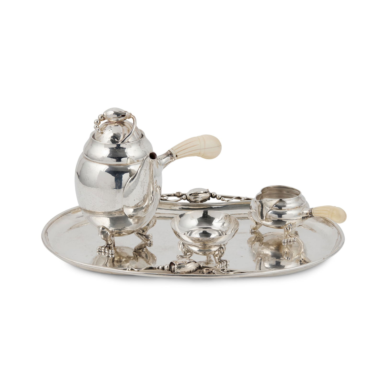 Y GEORG JENSEN (1866-1935): GEORG JENSEN (1866-1935) 'BLOSSOM'/ 'MAGNOLIA' COFFEE SERVICE, CIRCA 1945 silver and ivory, stamped maker's mark GEORG JENSEN DENMARK STERLING 925 S, comprising; a COFFEE POT, 12.5cm high, a SUGAR