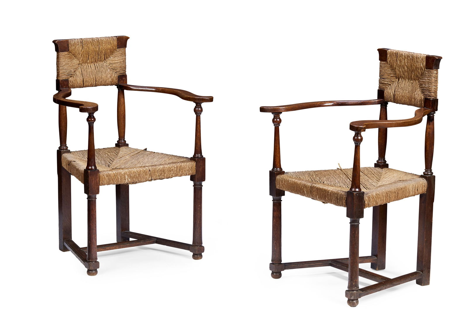 GEORGE WALTON (1867-1933): GEORGE WALTON (1867-1933) PAIR OF ARMCHAIRS, CIRCA 1900 oak, with rush seats (2) 56cm wide, 92cm high, 48.5cm deep Literature: Moon K. George Walton: Designer and Architect, Oxford 1993, page
