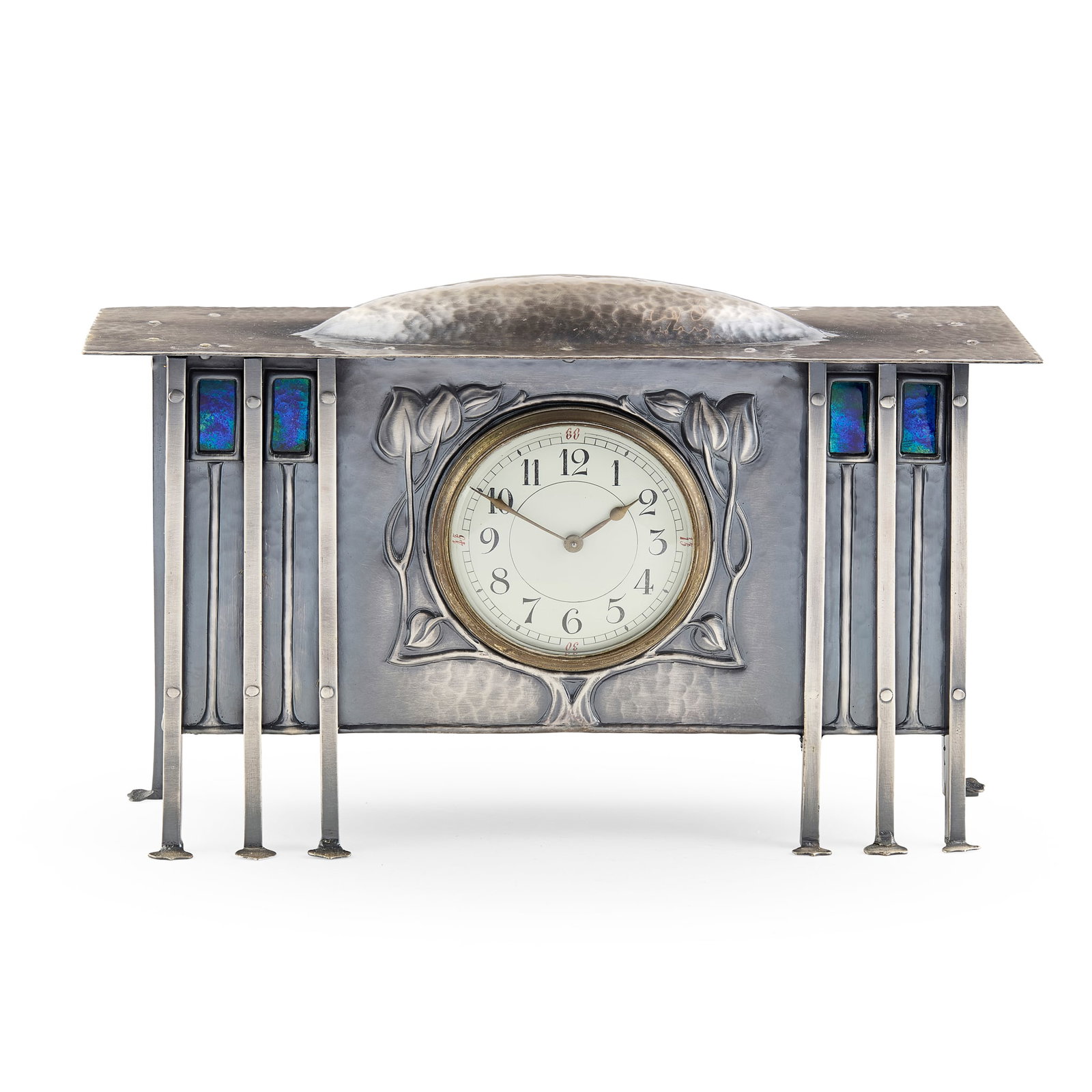 ATTRIBUTED TO GEORGE WALTON (1867-1933) FOR GOODYER'S, LONDON: ATTRIBUTED TO GEORGE WALTON (1867-1933) FOR GOODYER'S, LONDON MANTEL CLOCK, CIRCA 1910 hammered metal and enamel, later plated and enclosing a white enamel and painted dial 33.5cm wide, 21cm hig