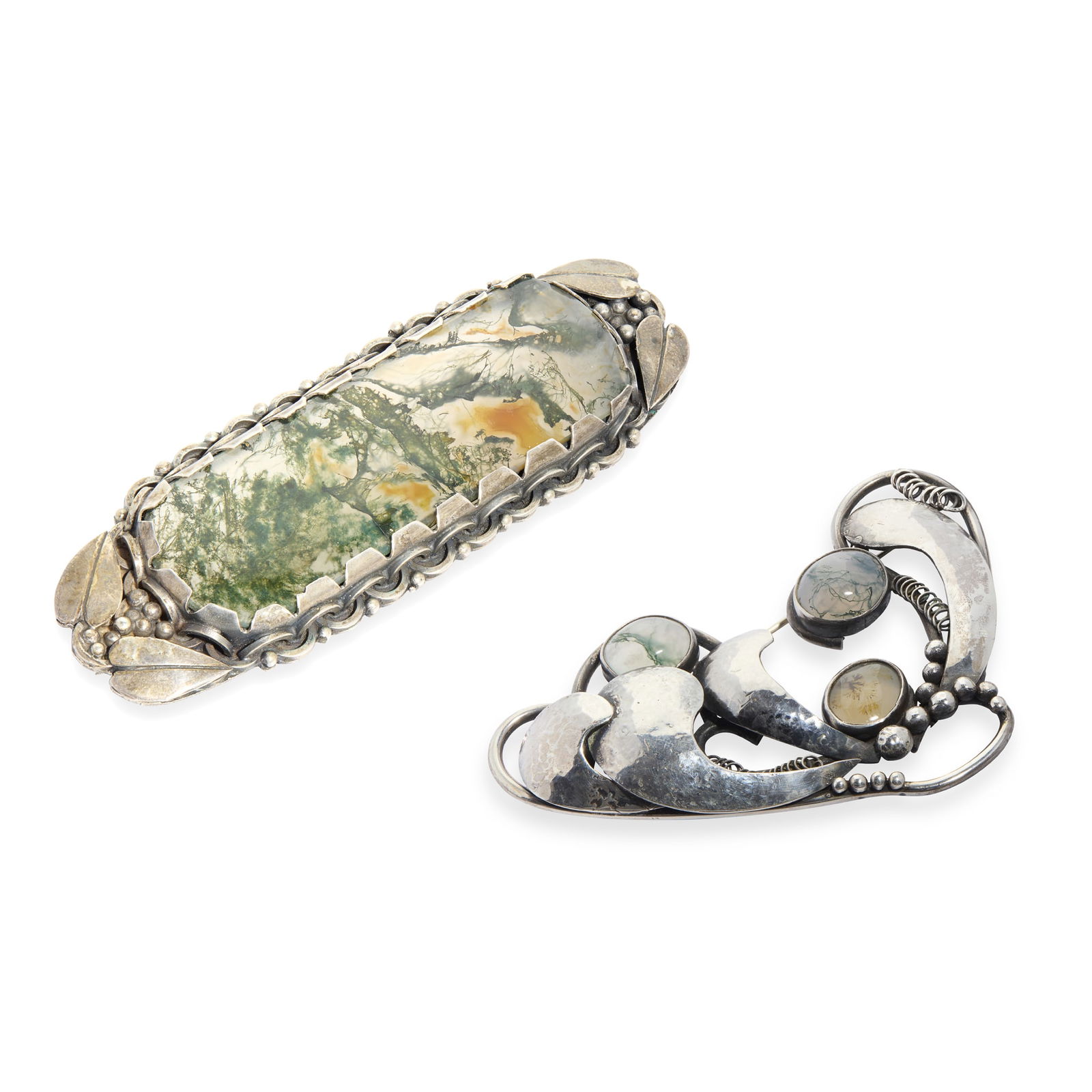 NORAH CRESWICK (1883-1976): NORAH CRESWICK (1883-1976) TWO ARTS & CRAFTS BROOCHES, CIRCA 1950 one white metal, set with moss agate cabochons, within branded box inscribed NORAH CRESWICK/ ARTIST JEWELLER/ 20, HARRISON ROAD/ EDINB