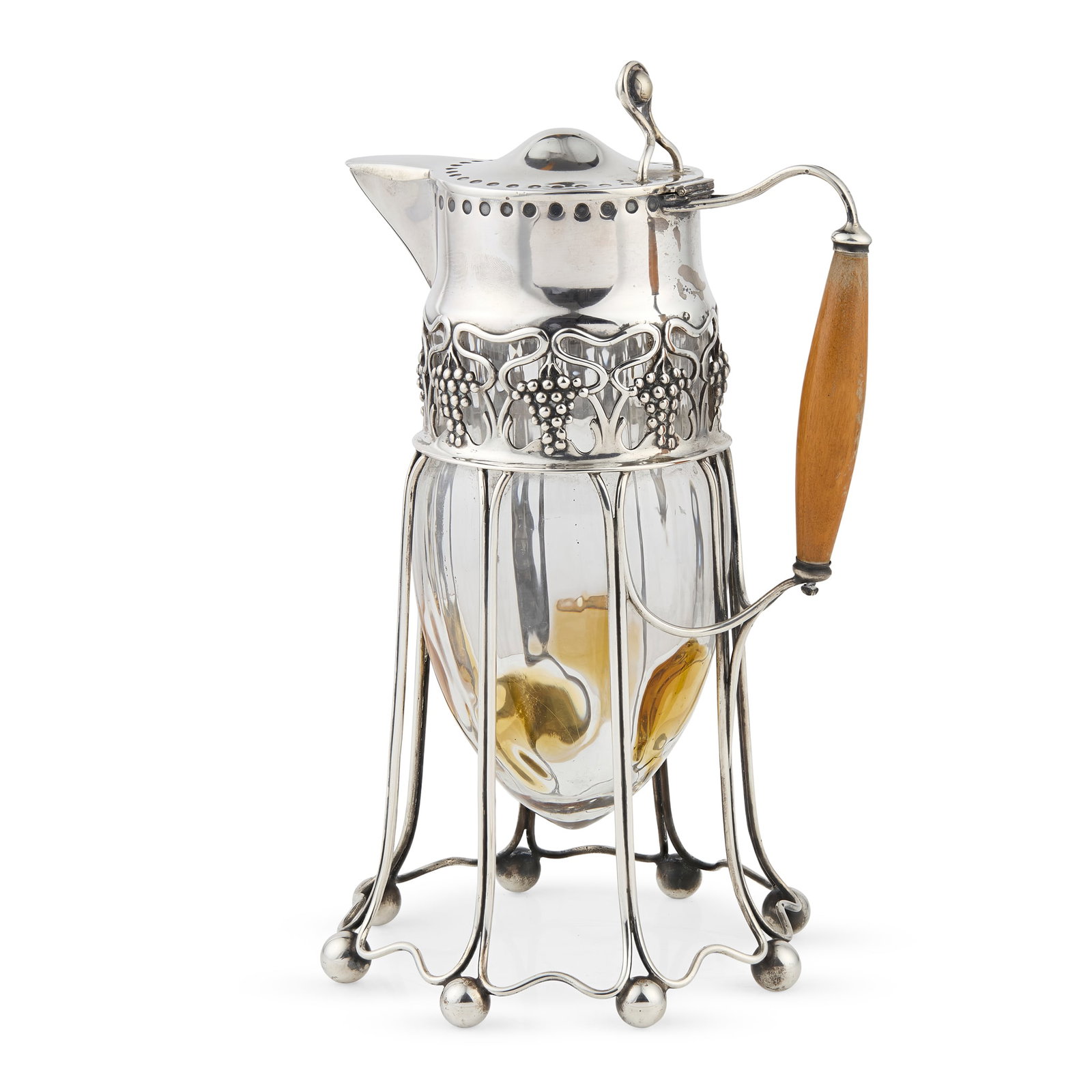 ATTRIBUTED TO C.R. ASHBEE (1863-1942) FOR GEBRUEDER FRANK, VIENNA: ATTRIBUTED TO C.R. ASHBEE (1863-1942) FOR GEBRUEDER FRANK, VIENNA JUGENDSTIL CLARET JUG, CIRCA 1905 silver plated metal, glass, polished wood, stamped maker's marks 29.7cm high Literature: Ashbee C.R.