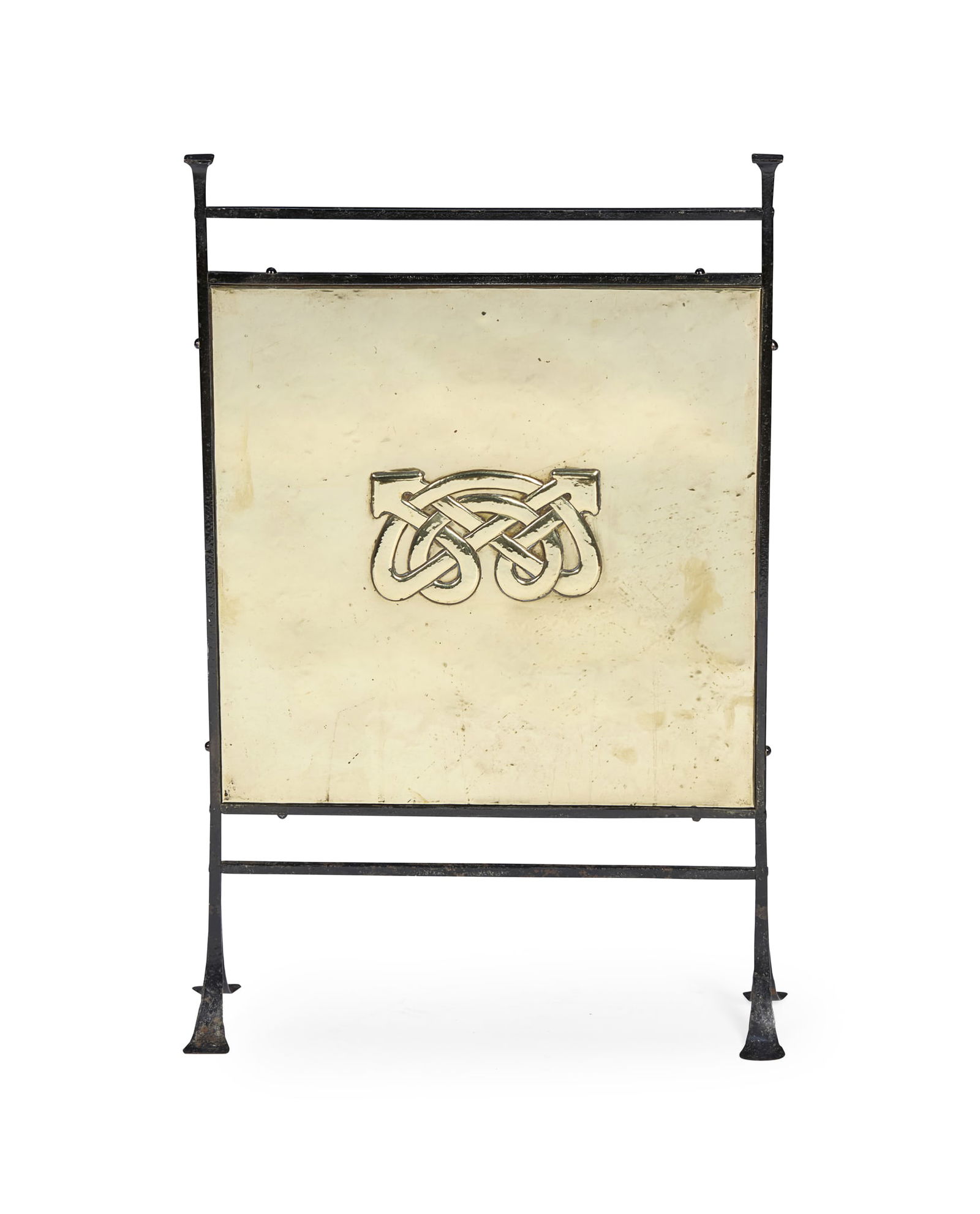 MANNER OF ARCHIBALD KNOX FOR LIBERTY & CO., LONDON: MANNER OF ARCHIBALD KNOX FOR LIBERTY & CO., LONDON CELTIC REVIVAL FIRESCREEN, CIRCA 1900 repoussé-decorated brass and patinated wrought iron 49cm wide, 77cm high 