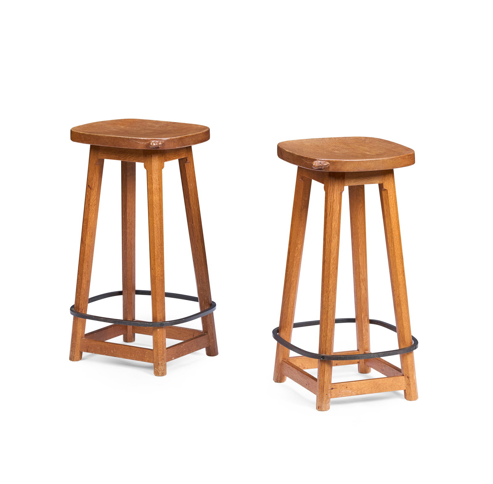 ROBERT 'MOUSEMAN' THOMPSON (1876-1955): ROBERT 'MOUSEMAN' THOMPSON (1876-1955) PAIR OF BAR STOOLS, CIRCA 1970 oak and wrought steel, each with carved mouse signature (2) 37cm wide, 67.5cm high, 32cm deep