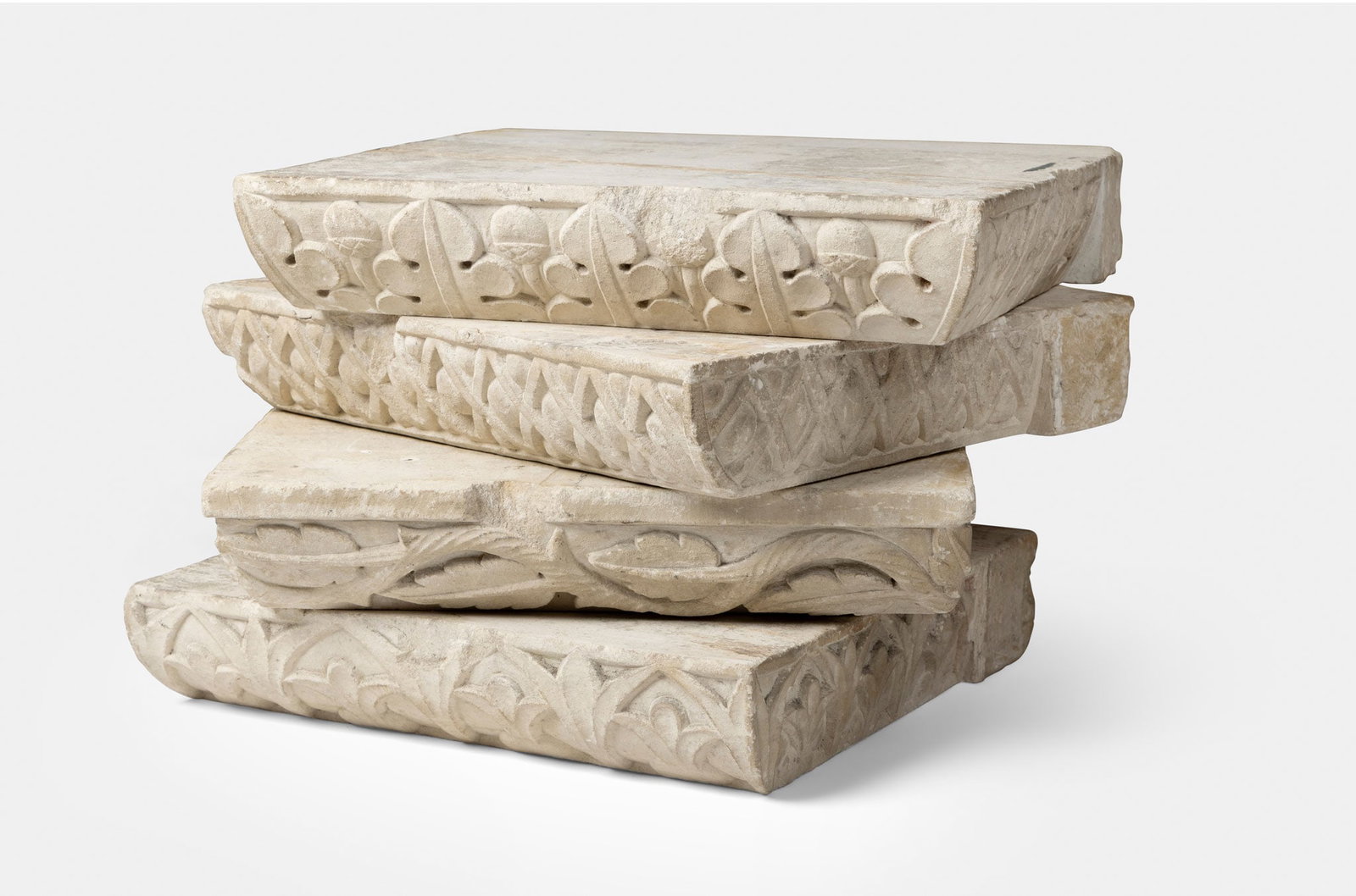 ERIC GILL A.R.A. (BRITISH 1882-1940): ERIC GILL A.R.A. (BRITISH 1882-1940) FOUR CAPITALS FROM THE CHAPEL OF ST. JOSEPH AND ST. DOMINIC, DITCHLING, 1921 Bath stone each 8cm x 40cm x 40cm, (3 1/8in x 15 ¾in x 15 ¾in) (4) Removed f