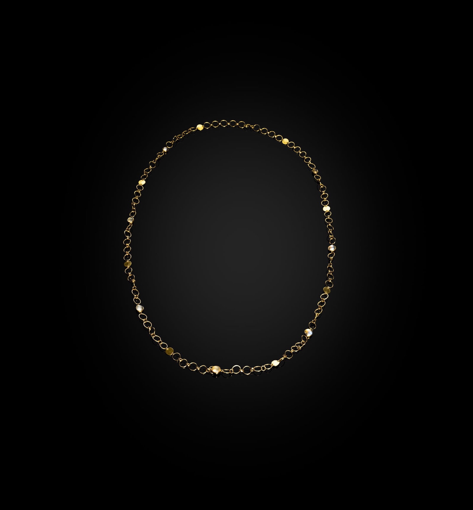 § BREON O'CASEY (BRITISH 1928-2011): BREON O'CASEY (BRITISH 1928-2011) LONG MOONSTONE NECKLACE unmarked, yellow metal and moonstones 49cm long (19 ¼in long), gross weight 41.1 grams Private Collection, London. Klaus and Gertrud Ansc