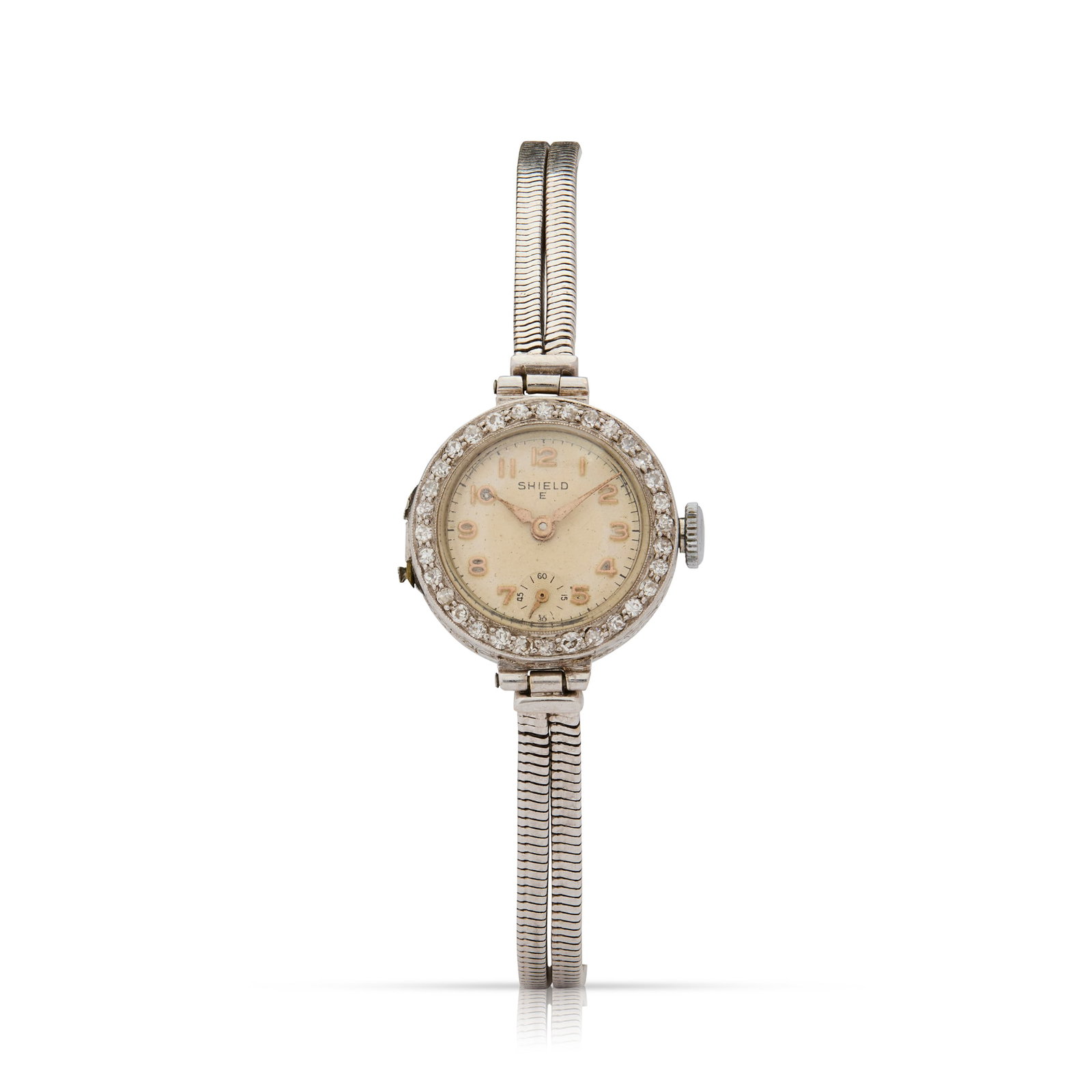 Shield E. A platinum and diamond mechanical cocktail watch: Shield E. A platinum and diamond mechanical cocktail watch 1930s Swiss hand-wound 15 jewel movement, silvered dial with applied rose gilt numerals, subsidiary seconds, rose index hands, circular plati