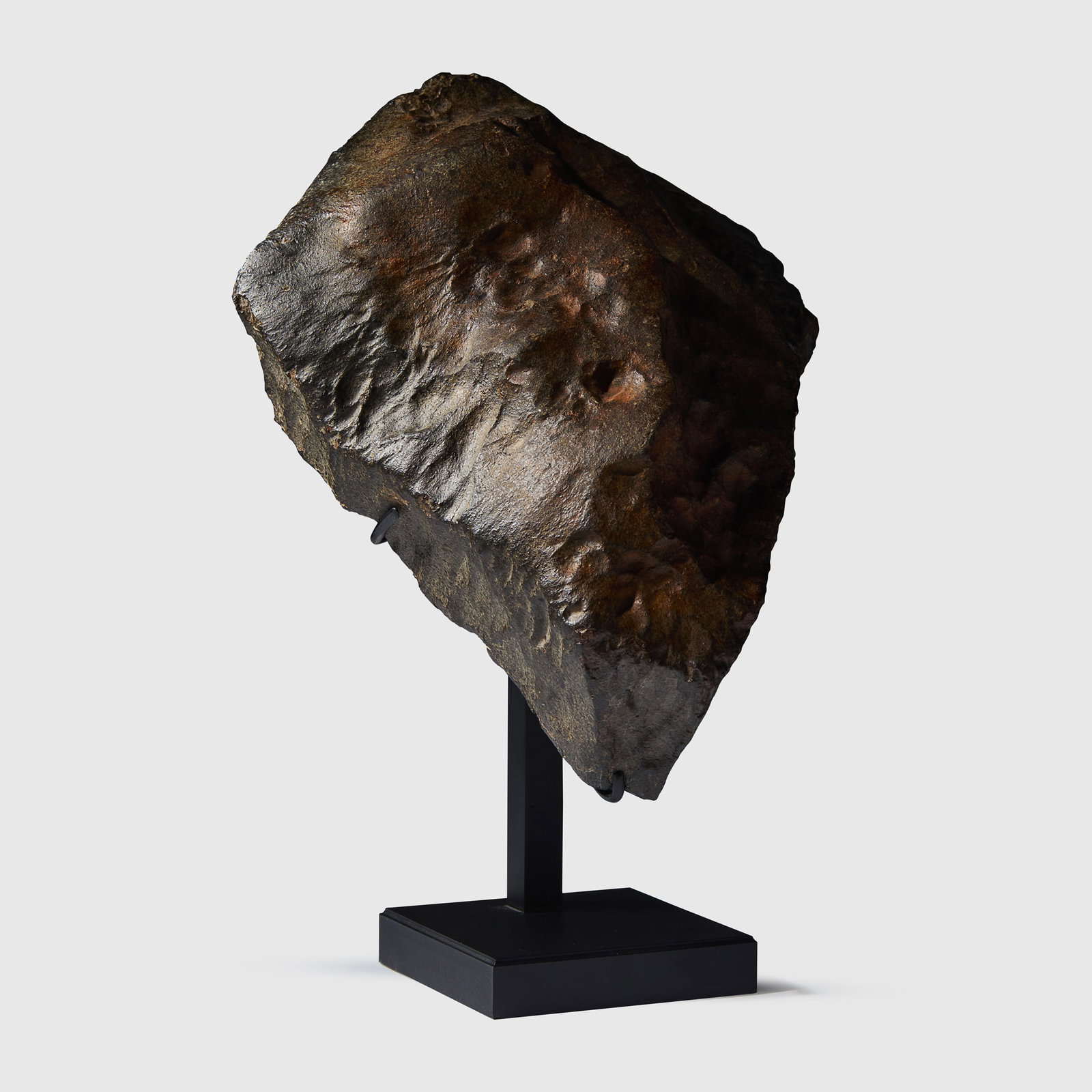 LARGE AND SCULPTURAL ORIENTATED METEORITE: LARGE AND SCULPTURAL ORIENTATED METEORITE CHONDRITE, SAHARA DESERT, NORTH-WEST AFRICA a substantial and highly sculptural orientated chondrite, exhibiting a trapezoidal form with traces of fusion