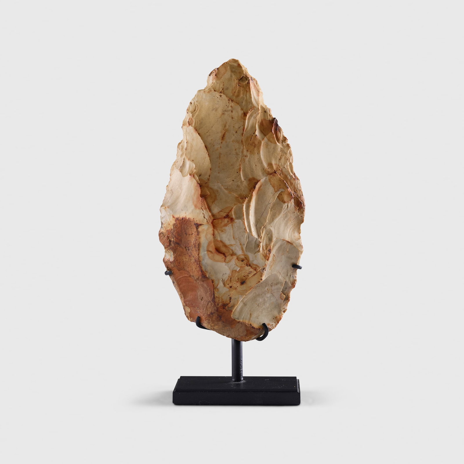 FLINT HANDAXE: FLINT HANDAXE TROYES, NORTHEASTERN FRANCE, MIDDLE PALEOLITHIC PERIOD, C. 300,000 ? 100,000 B.C. knapped flint, with a beautiful foliate form, a large and impressive buff and ochre coloured handaxe, un