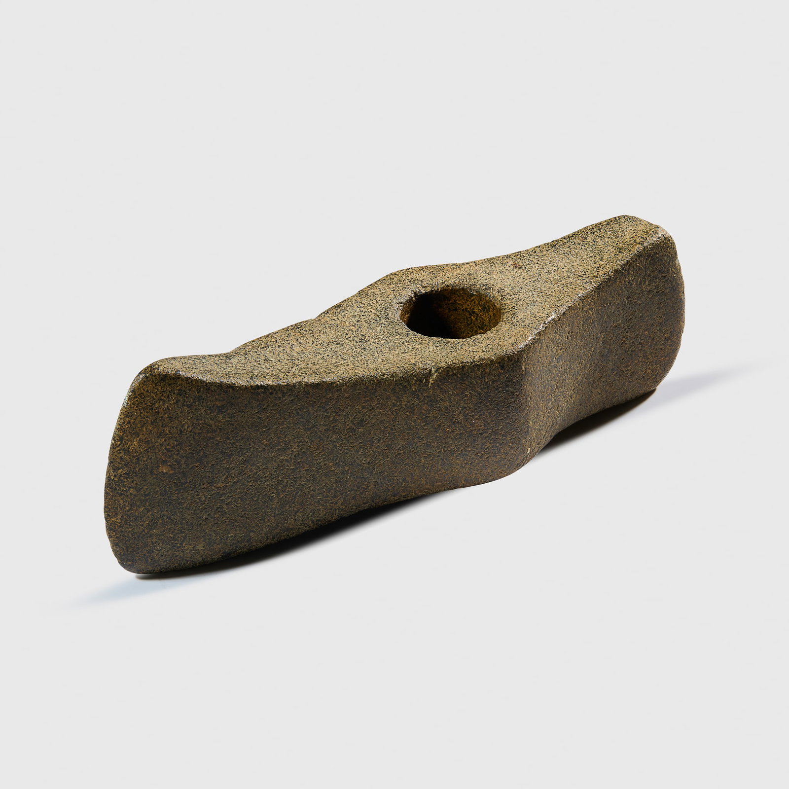 NORDIC STONE BATTLE AXE: NORDIC STONE BATTLE AXE SCANDINAVIA, NEOLITHIC PERIOD, C. 3RD MILLENNIUM B.C. carved stone, dual cutting edges featuring an elegant tapering form, with an off-centre circular perforation, the surface 