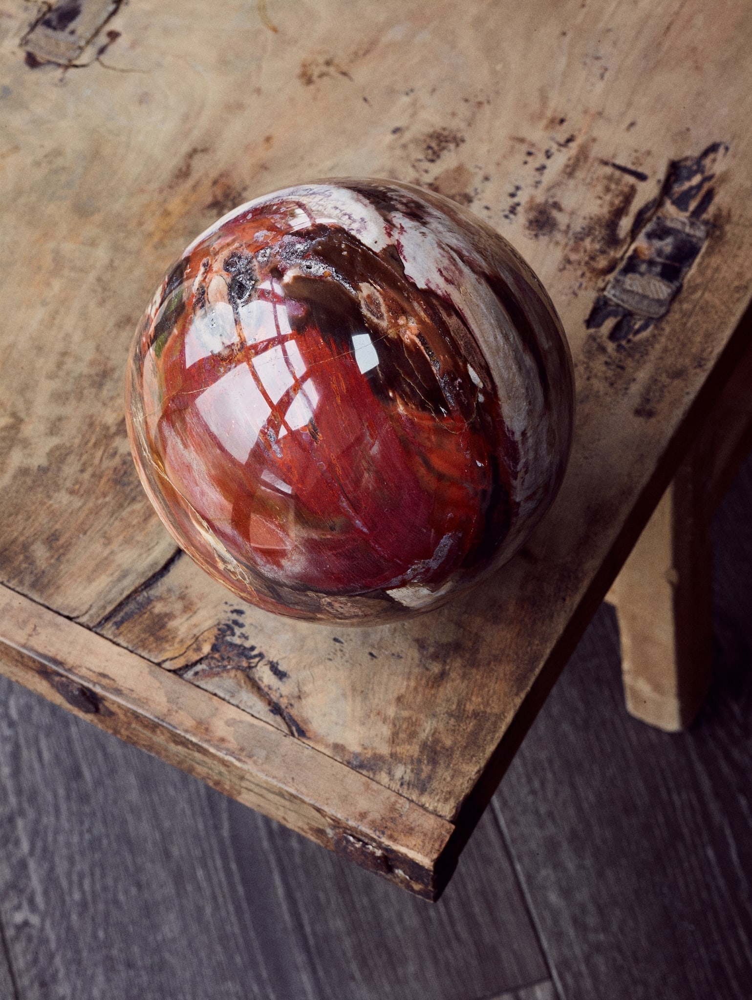 FOSSILISED WOOD SPHERE: FOSSILISED WOOD SPHERE ISALO II FORMATION, AMBILOBE, MADAGASCAR, TRIASSIC PERIOD, C. 220 MILLION YEARS B.P. a single large specimen of fossilised conifer wood from the species araucaria, worked into s