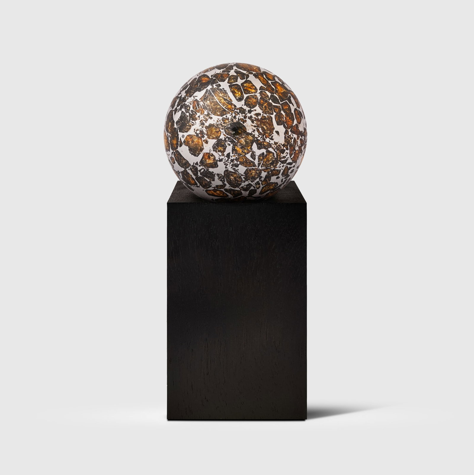 PALLASITE METEORITE SPHERE: PALLASITE METEORITE SPHERE SEYMCHAN, MAGADAN DISTRICT, RUSSIA (62?54? N, 152?26? E), FORMED 4.56 BILLION YEARS B.P. the sphere with abundant olivine crystals suspended within the iron-nickel matrix, r