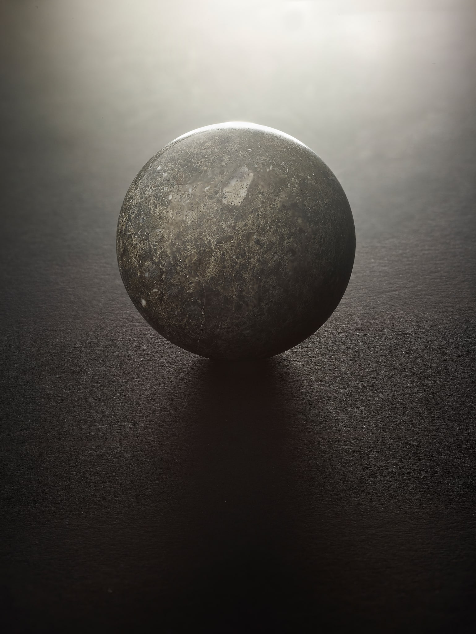 A PIECE OF THE MOON, WORKED INTO A SPHERE: A PIECE OF THE MOON, WORKED INTO A SPHERE LAAYOUNE 002, 27.070?N, 13.202?W Specimens of Moon rock are among the rarest substances on Earth, with only around 750 kilograms of confirmed lunar meteorites