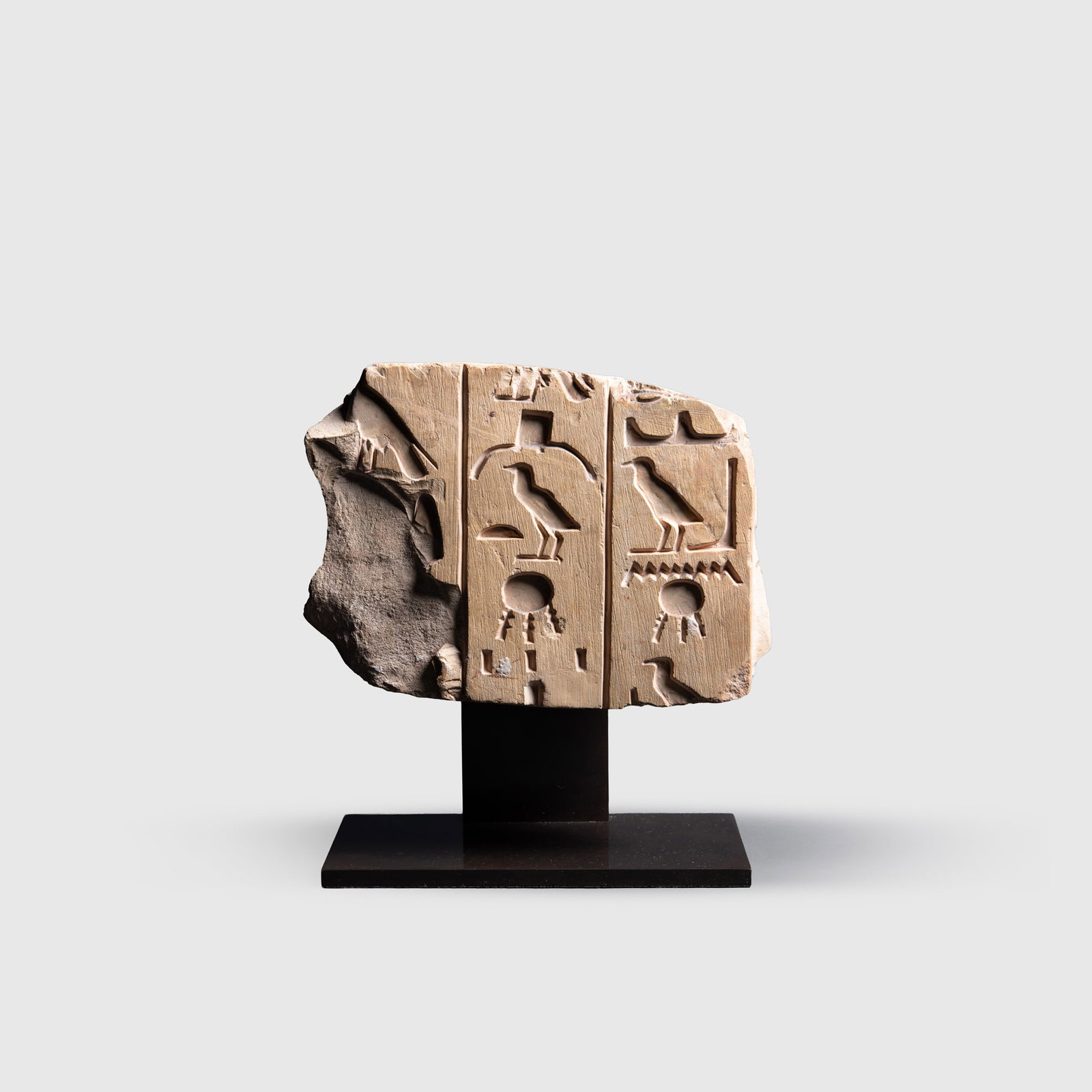 ANCIENT EGYPTIAN RELIEF FRAGMENT: ANCIENT EGYPTIAN RELIEF FRAGMENT EGYPT, NEW KINGDOM, C. 1550-1069 B.C. carved limestone, finely carved in shallow relief with a trio of columns of inscription containing a ritual text, with traces of 