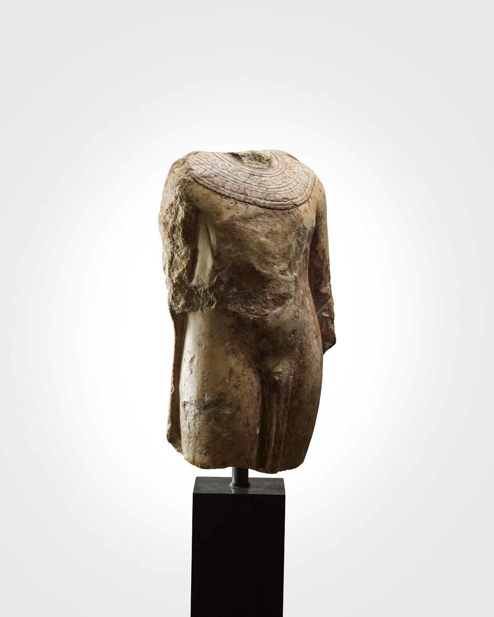 ? LARGE ROMAN TORSO OF AN EGYPTIAN PRIEST: LARGE ROMAN TORSO OF AN EGYPTIAN PRIEST EUROPE, IMPERIAL PERIOD, 1ST - 2ND CENTURY A.D. carved alabaster, the large fragmentary figure shown in fine drapery, with an angled posture, the chest and abdo