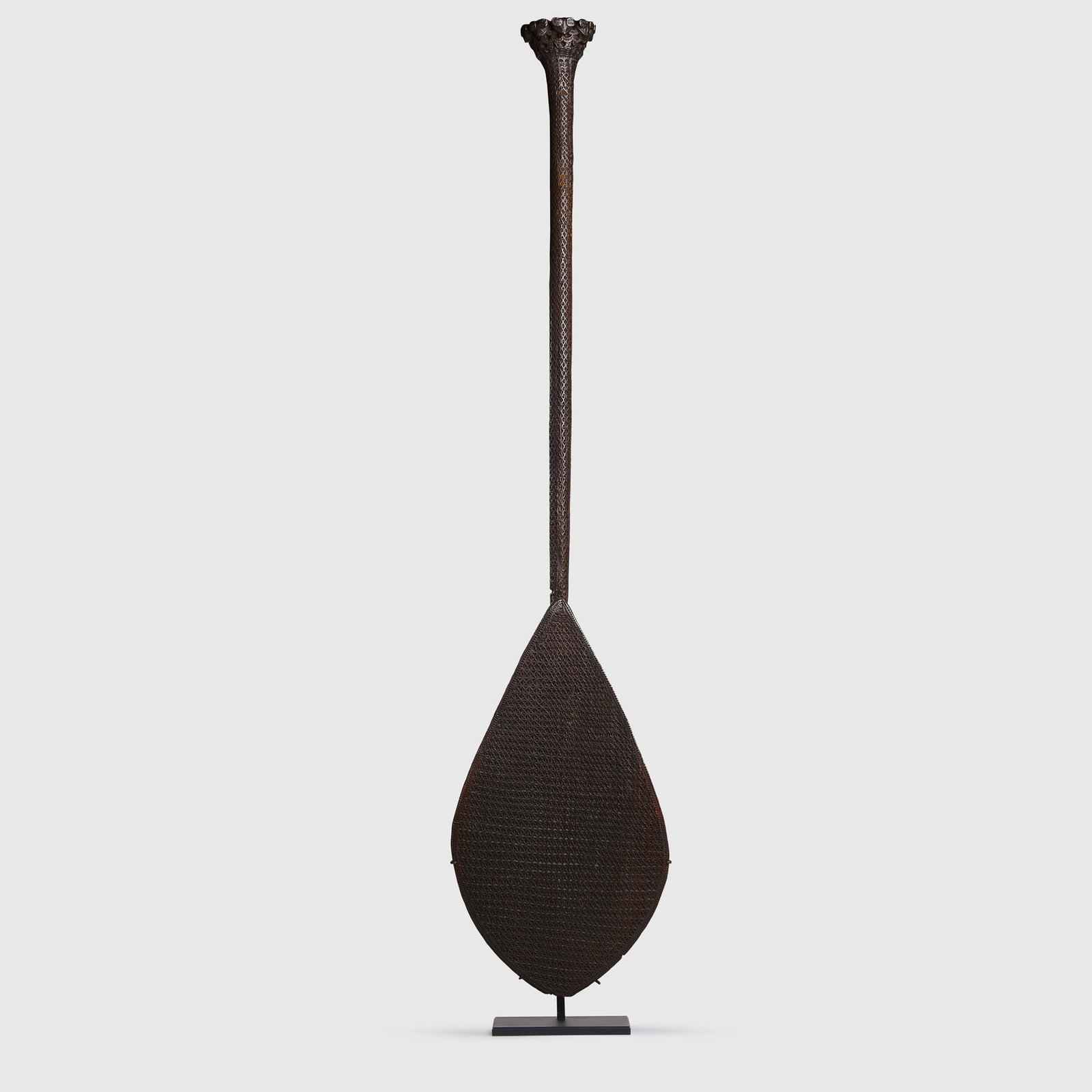 CEREMONIAL PADDLE: CEREMONIAL PADDLE RAIVAVAE, AUSTRAL ISLANDS, 19TH CENTURY carved wood, densely carved with geometric motifs throughout, the paddle blade leading to a long cylindrical shaft and a rounded pommel sculpt