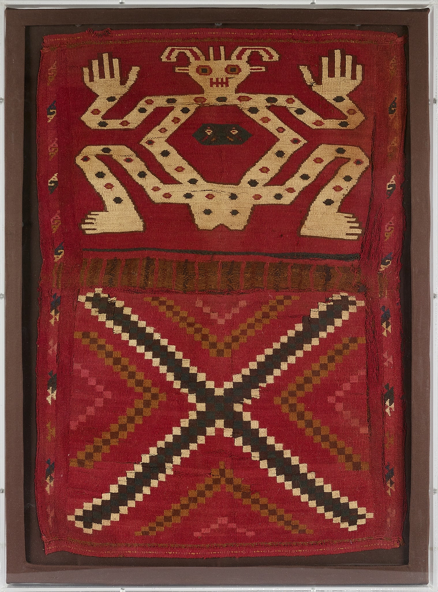 HUARI TEXTILE COCO BAG: HUARI TEXTILE COCO BAG PERU, C. 700 - 1000 A.D. woven and dyed camelid wool, rectangular textile panel with a red ground, arranged in two registers, the upper register shows a stylised frontal figure 