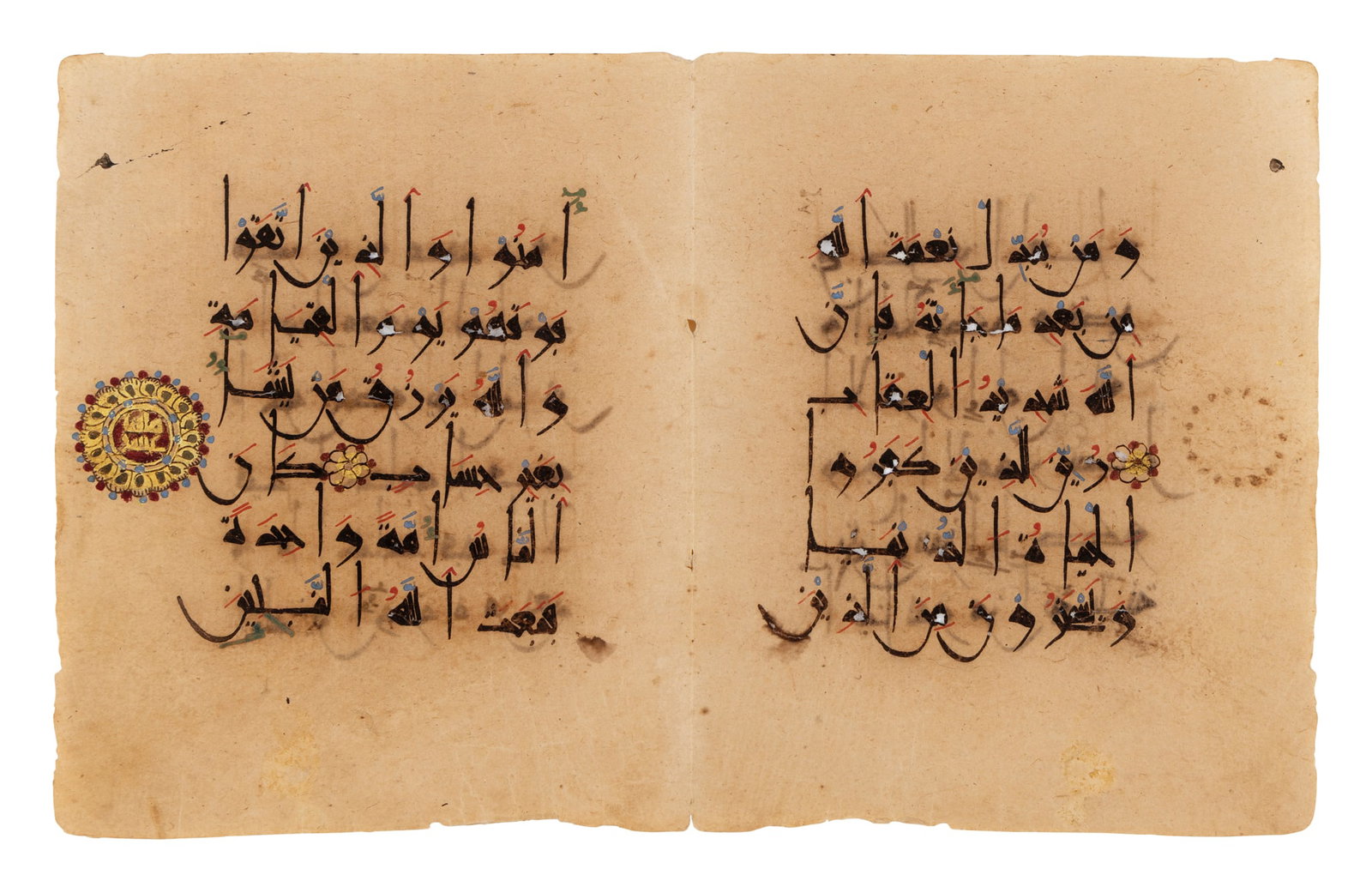 A FINE ILLUMINATED PINK KUFIC QUR'AN BIFOLIUM (1 of 2)