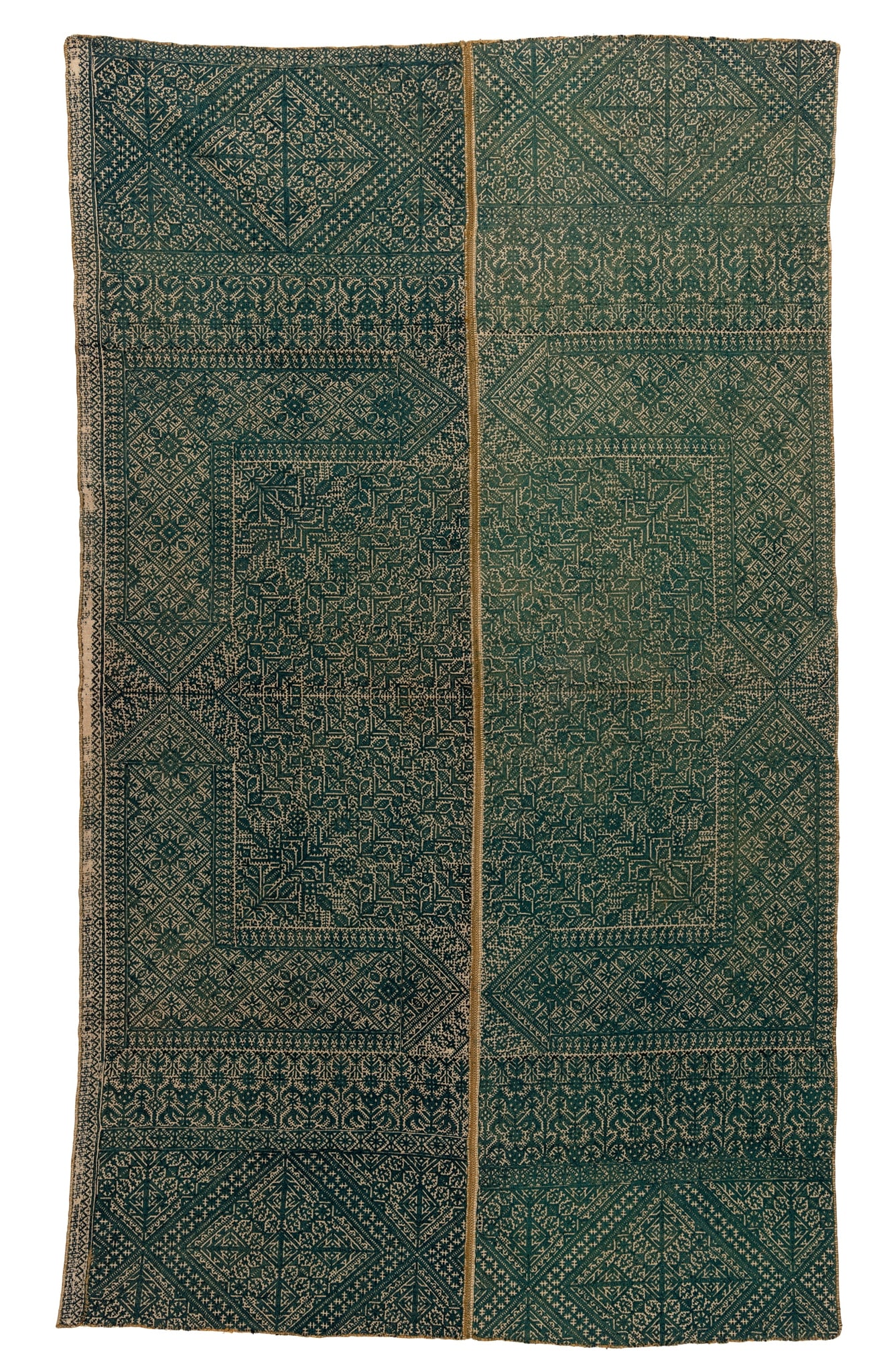 A LARGE EMBROIDERED GREEN PANEL WITH GEOMETRIC MOTIFS: A LARGE EMBROIDERED GREEN PANEL WITH GEOMETRIC MOTIFS NORTH AFRICA, FEZ, 19TH CENTURY rectangular, formed of two lengths sewn together, each intricately embroidered in rich green threads with symmetri