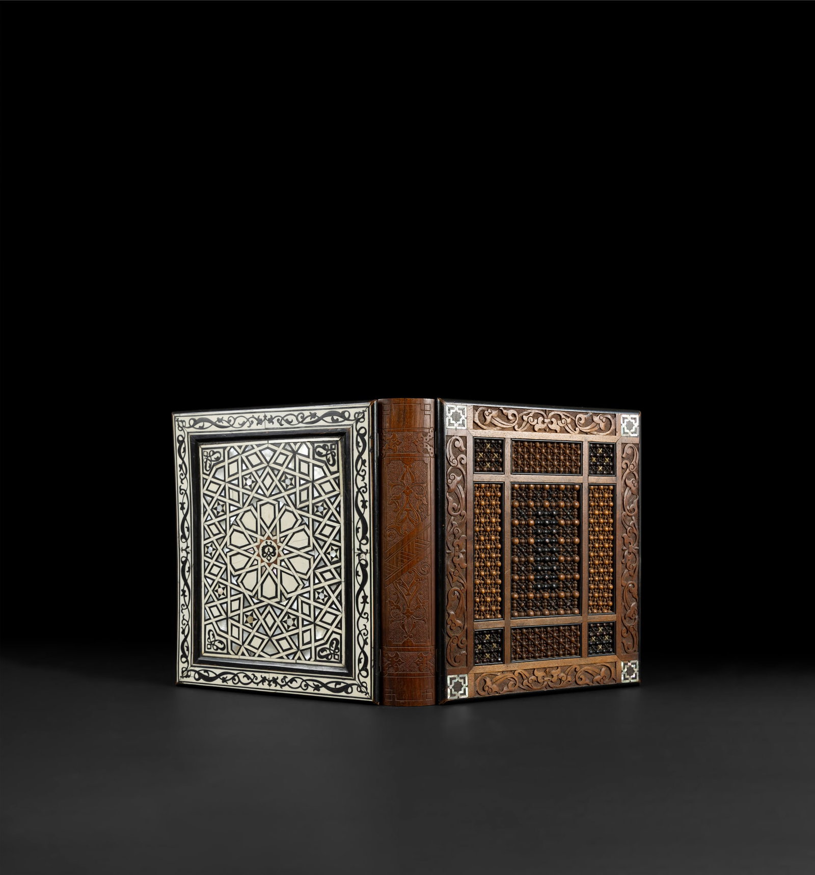 A FINE OTTOMAN BOOK COVER: A FINE OTTOMAN BOOK COVER TURKEY, LATE 19TH/ EARLY 20TH CENTURY of typical form made of wood, the front cover inlaid with bone, mother-of-pearl and stained wood elements forming Ottoman-style geometri