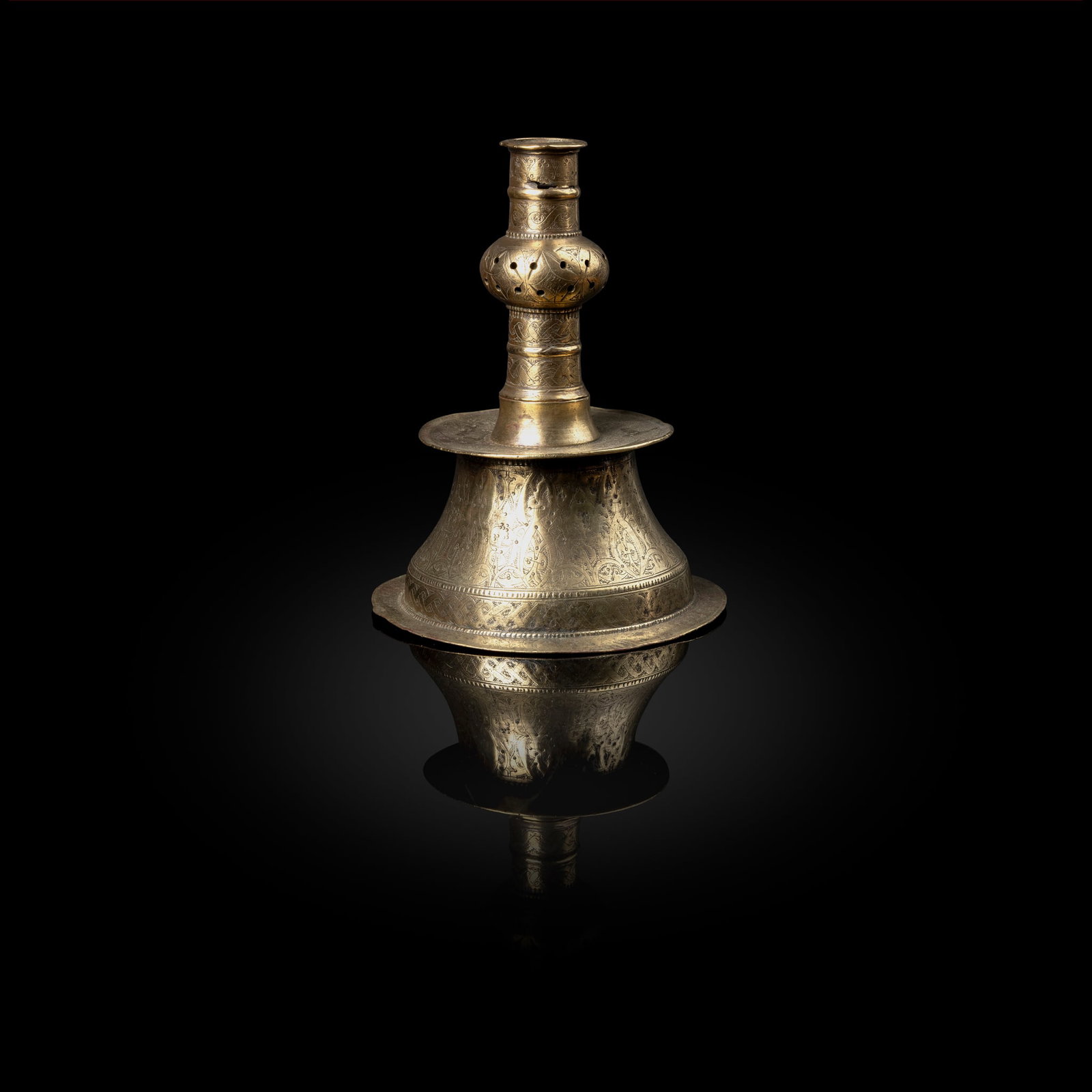AN EARLY OTTOMAN ENGRAVED BRASS CANDLESTICK (1 of 2)