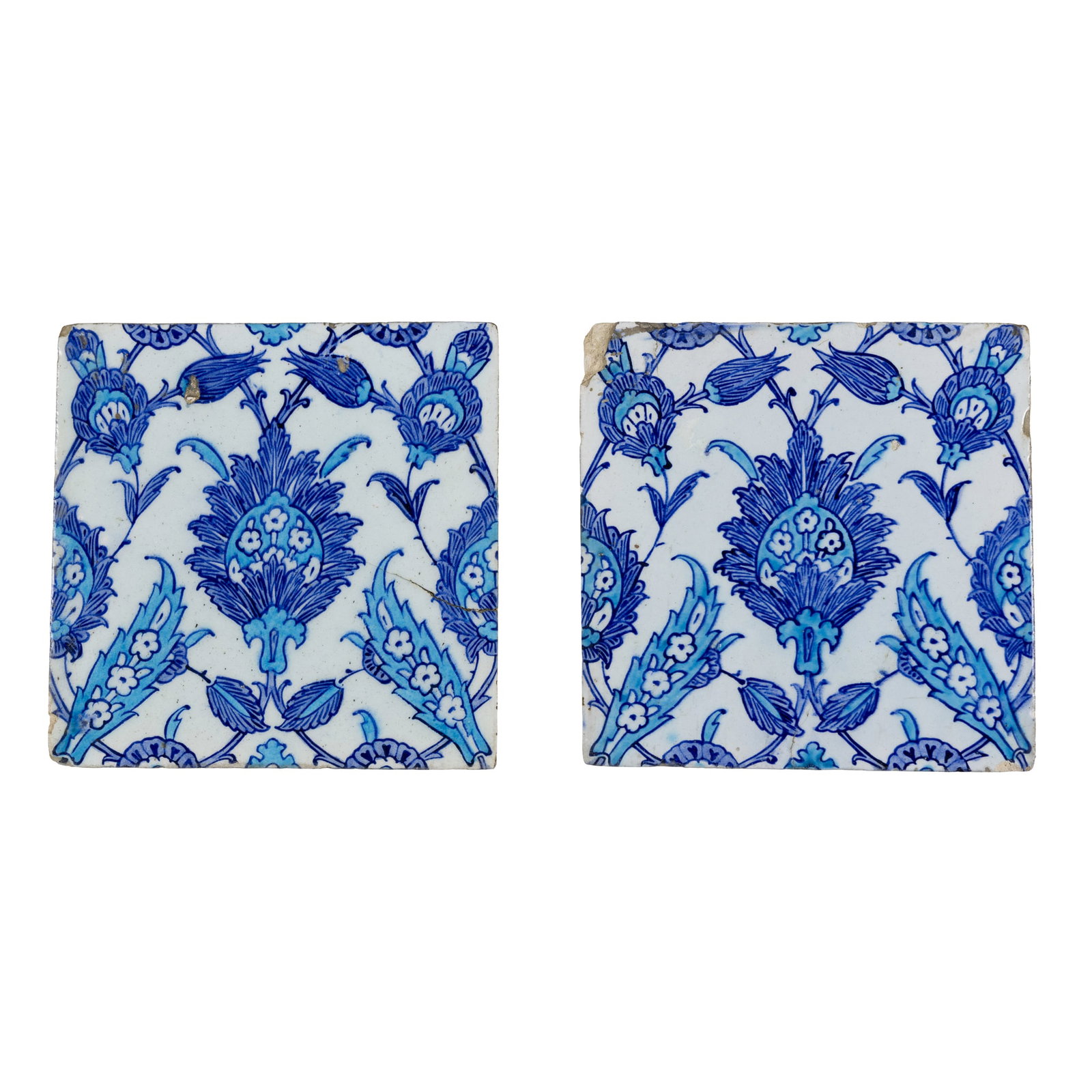 A PAIR OF IZNIK BLUE AND WHITE POTTERY TILES (1 of 3)