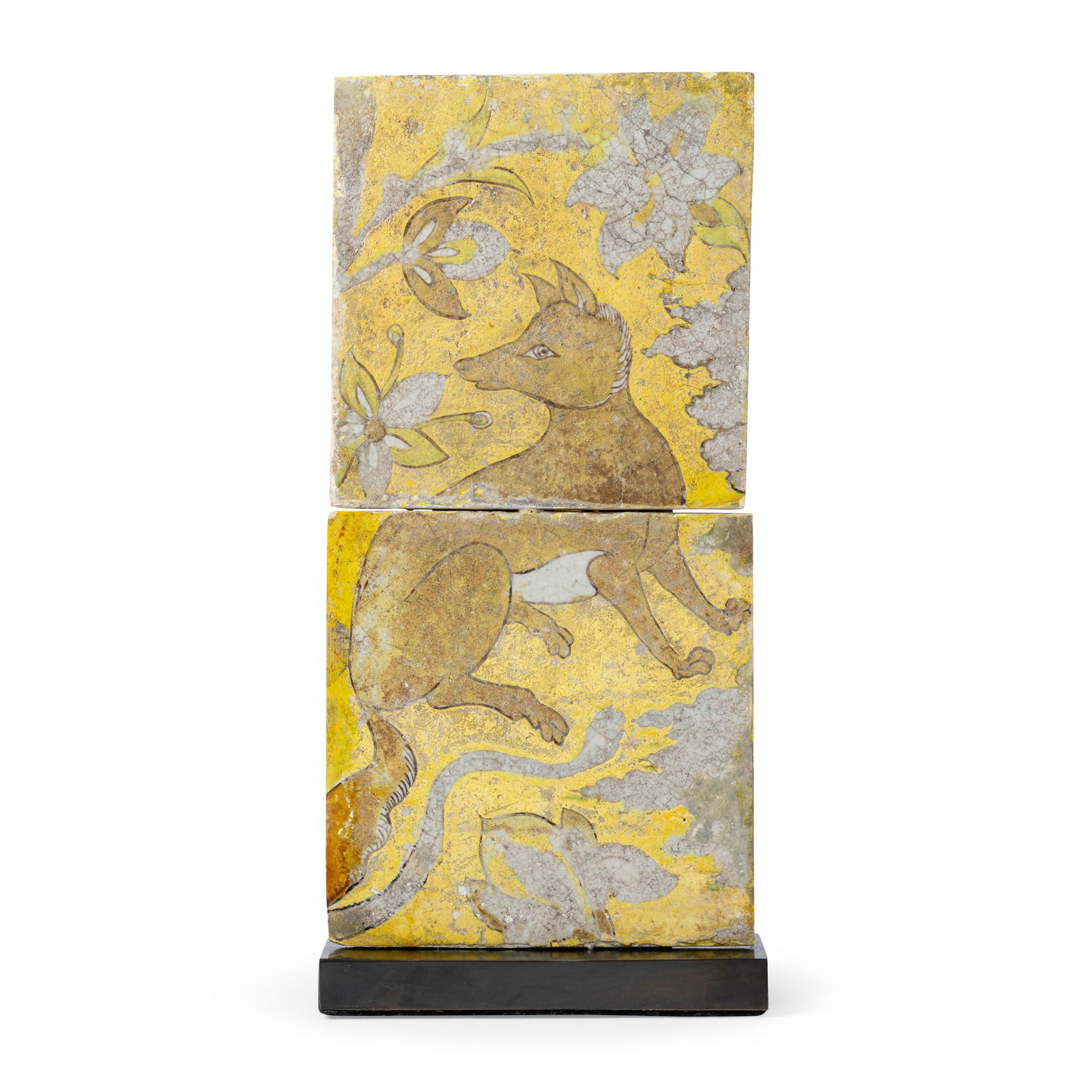 A PAIR OF SAFAVID CUERDA SECA POTTERY TILES WITH A FOX OR WILD DOG: A PAIR OF SAFAVID CUERDA SECA POTTERY TILES WITH A FOX OR WILD DOG PERSIA, 17TH CENTURY each tile is of square form, decorated in brown, yellow and manganese on a yellow ground with black outline, dep