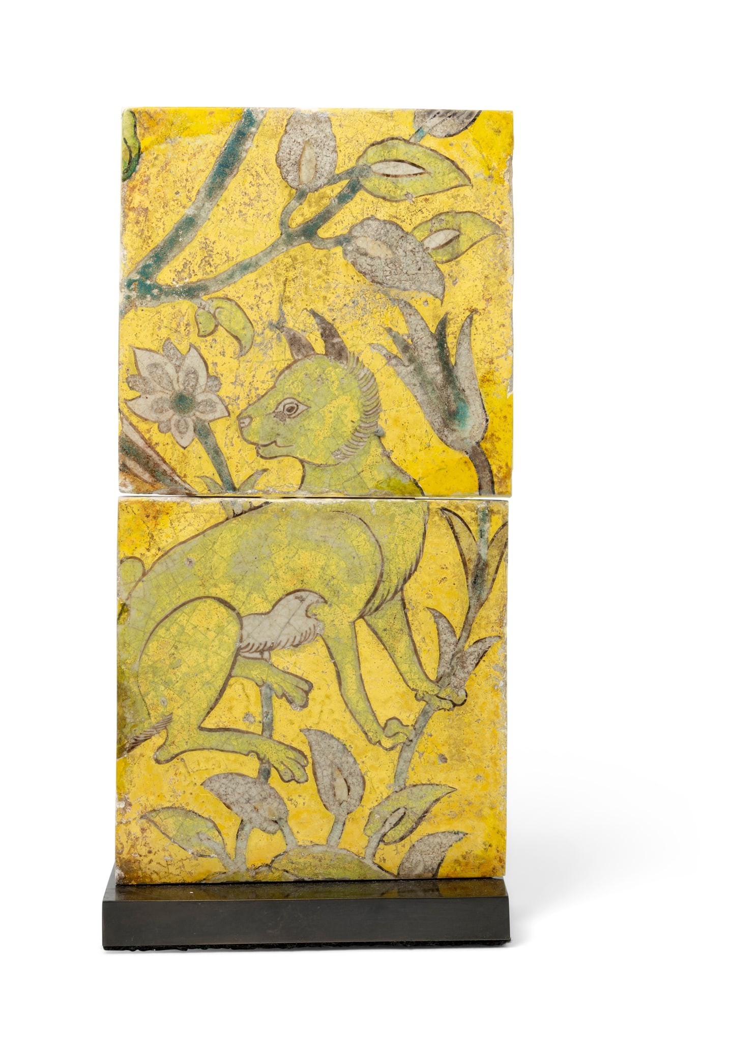 A PAIR OF SAFAVID CUERDA SECA POTTERY TILES WITH A FOX OR WILD DOG: A PAIR OF SAFAVID CUERDA SECA POTTERY TILES WITH A FOX OR WILD DOG PERSIA, 17TH CENTURY each tile is of square form, decorated in green, blue and manganese on a yellow ground, depicting a wild dog sur