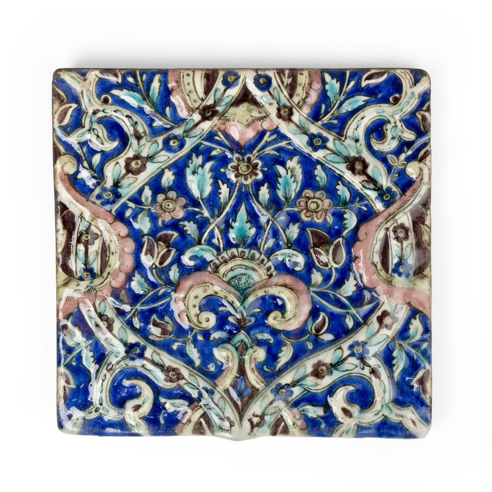 A SMALL QAJAR POTTERY TILE (1 of 3)