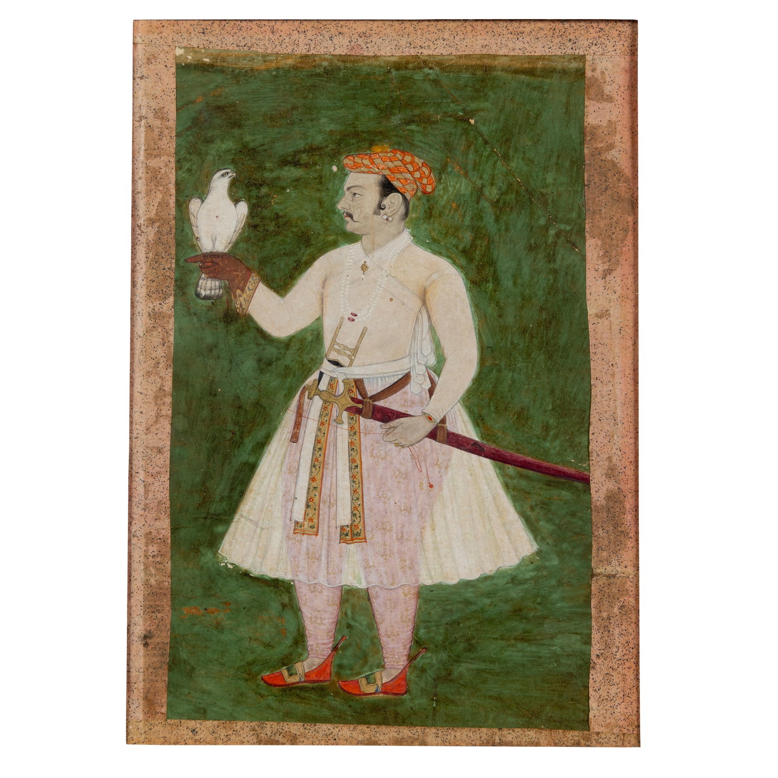 A MUGHAL FALCONER, POSSIBLY THE EMPEROR JAHANGIR: A MUGHAL FALCONER, POSSIBLY THE EMPEROR JAHANGIR INDIA, RAJASTAN, FIRST QUARTER 17TH CENTURY gouache on paper heightened in gold, within a light red and green border, depicting a Mughal noble (possibl