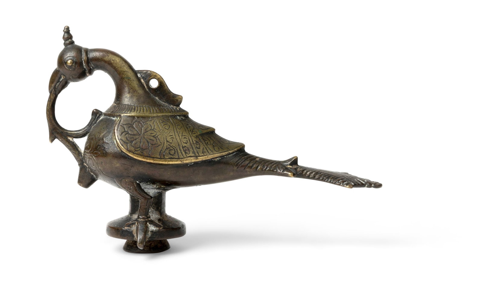 A DECCANI BRONZE OIL CONTAINER: A DECCANI BRONZE OIL CONTAINER INDIA, DECCAN, 16TH CENTURY cast in the form of a bird with naturalistic details with extended tail, surmounted by a hoop on the neck, its beak with handle extended to t