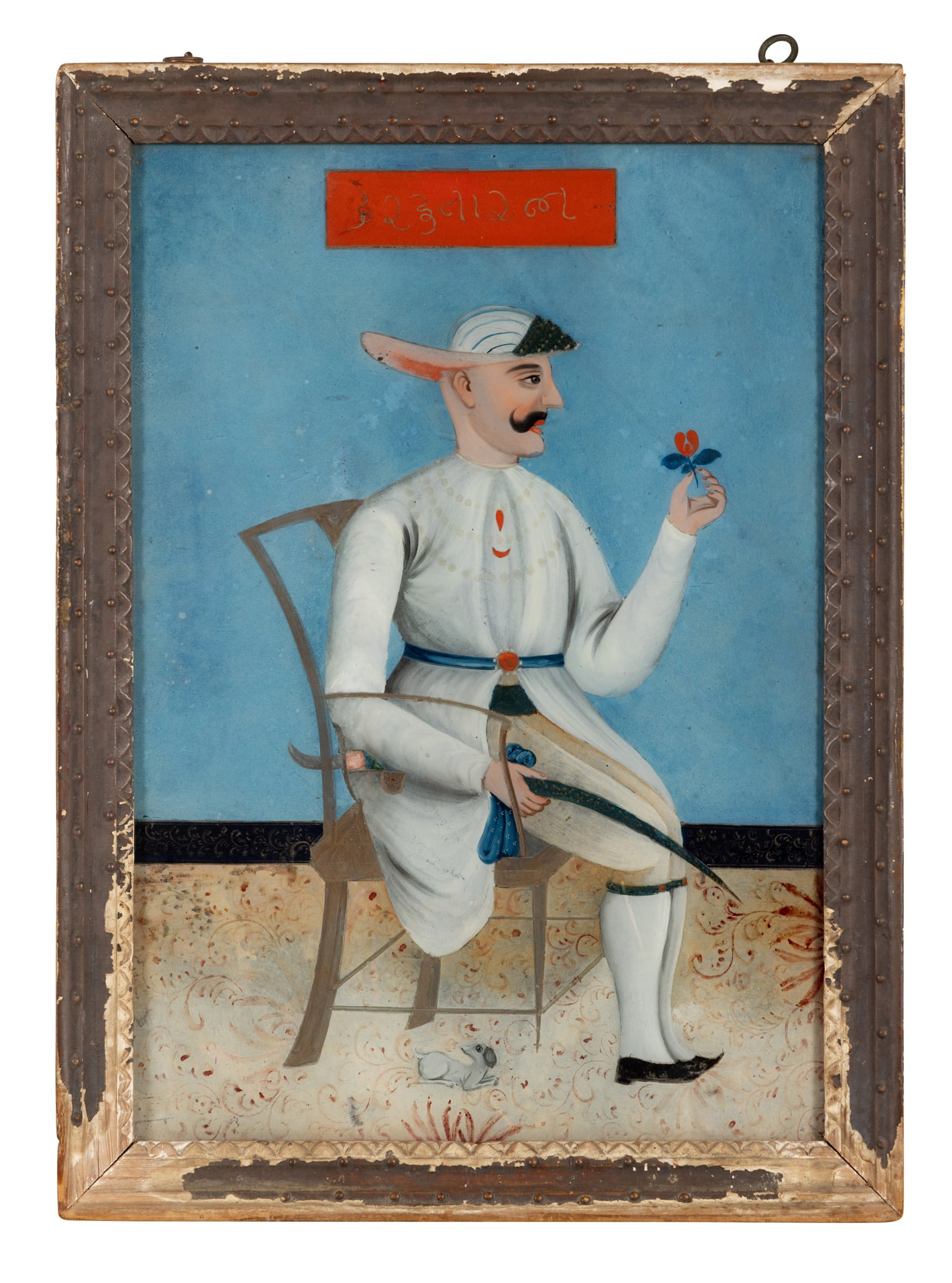 A SEATED NOBLEMAN: A SEATED NOBLEMAN INDIA, 19TH CENTURY Chinese export reverse-painted glass picture, made for the Indian market, depicting a seated nobleman in white robes facing to the right holding a sword in one ha