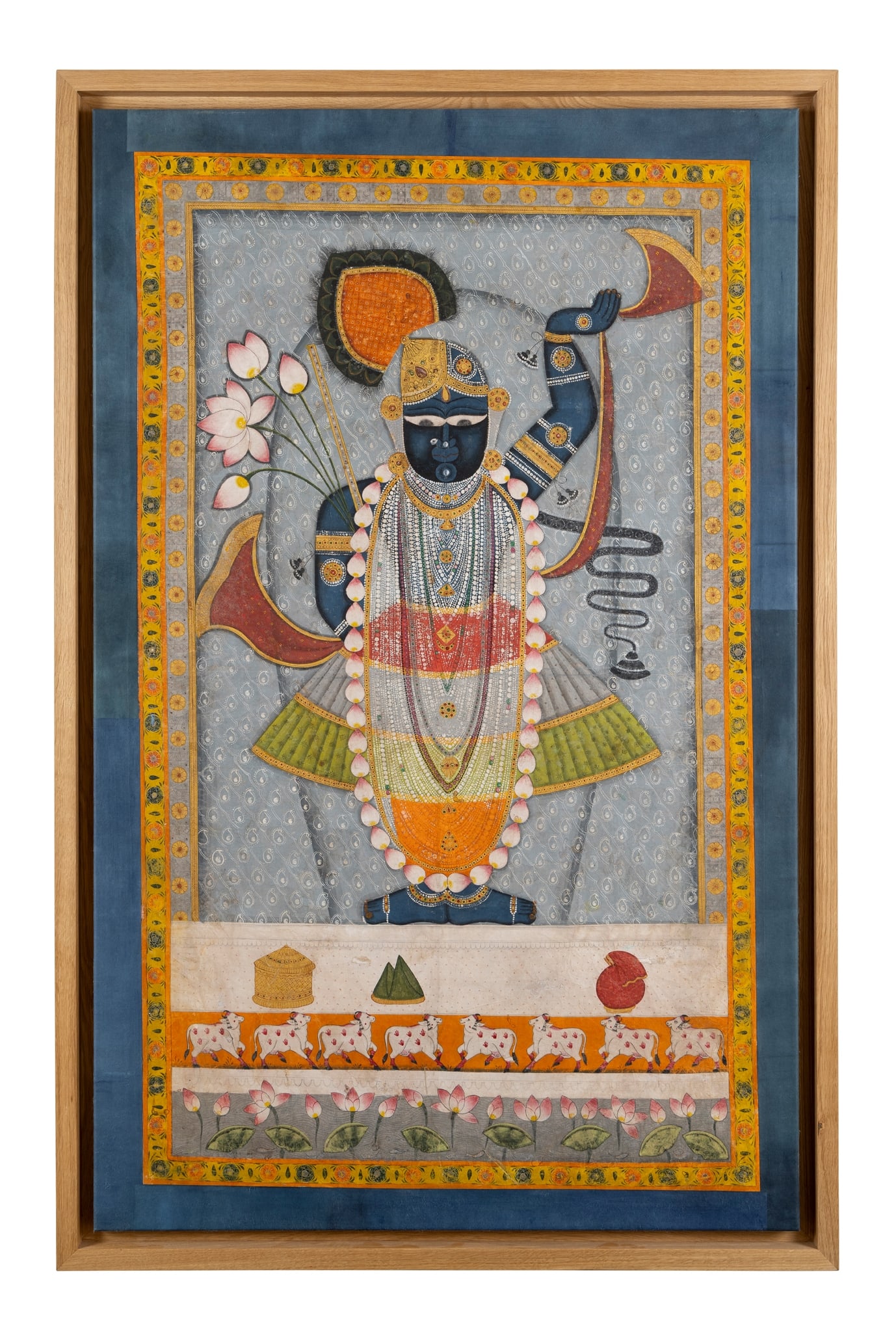 A FINE PICCHAVAI OF SRI NATHJI: A FINE PICCHAVAI OF SRI NATHJI INDIA, RAJASTHAN, NATHDWARA, 19TH CENTURY gouache on cloth with silver and gold highlights, depicting Sri Nathji wearing beaded and pearl necklaces, garlands of flowers 