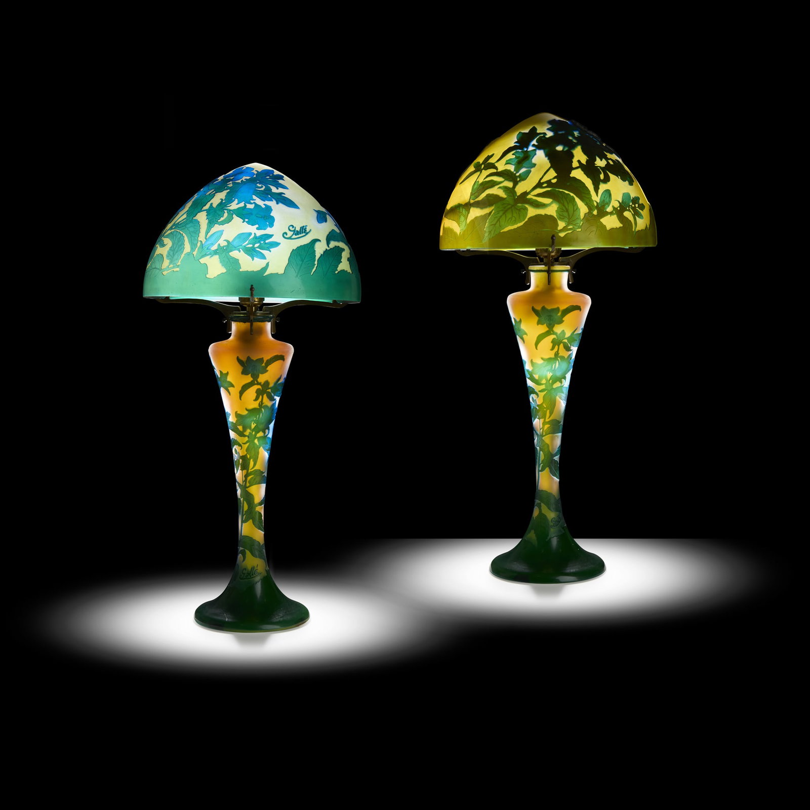GALLÉ: GALLÉ TWO CAMPANULES CAMEO GLASS TABLE LAMPS designed circa 1925overlaid and acid-etched glass, metal mountsbases and shades cameo Gallé(4) H62cm; 23cm diameter