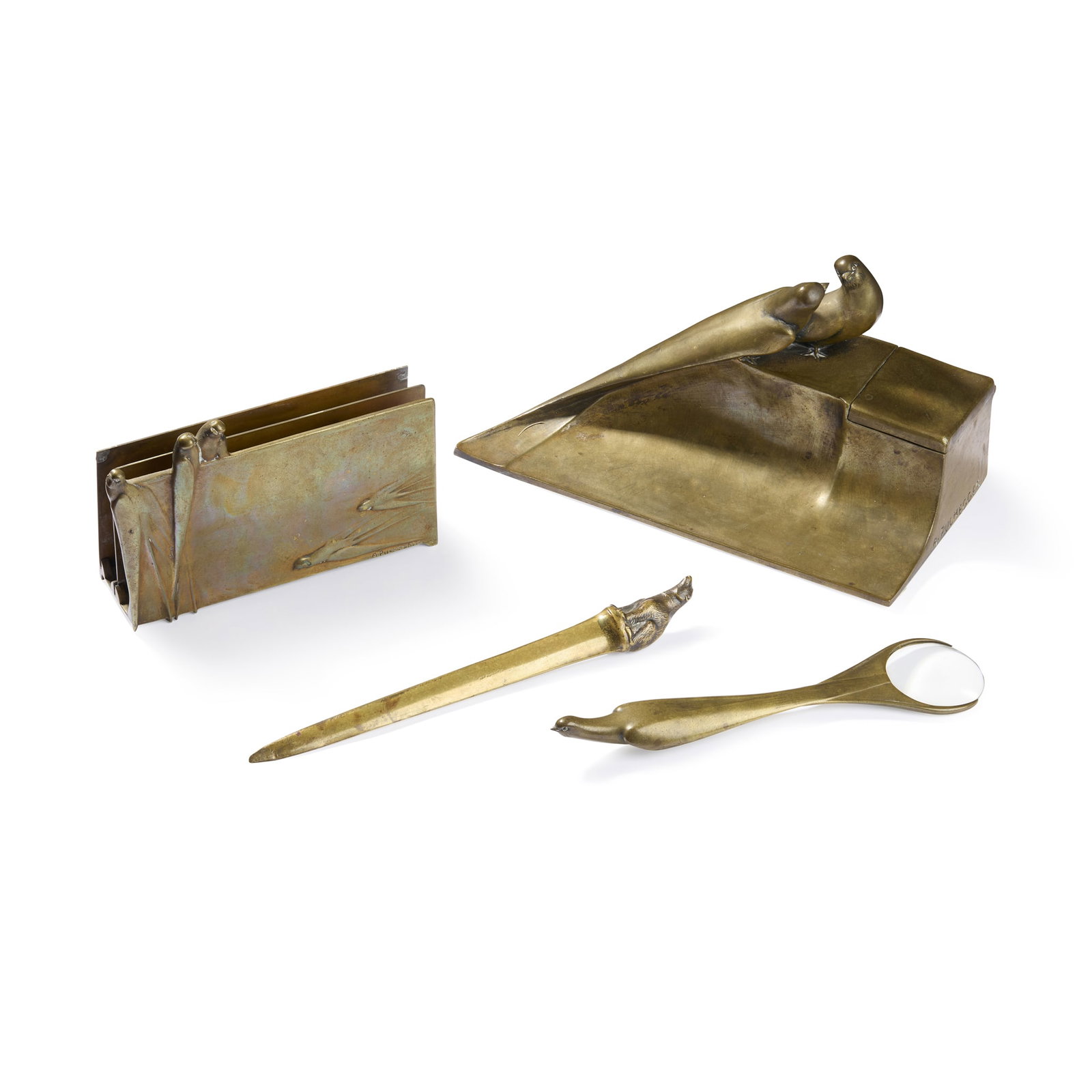 ‡ ANTON PUCHEGGER (1878-1917): ANTON PUCHEGGER (1878-1917) DESK SET circa 1910comprising inkwell, letter stand and magnifying glass, together with a letter opener with bear finialpatinated bronze and glassinkwell and letter
