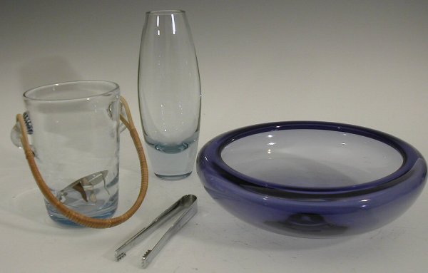 A Holmegaard blue glass bowl, . of circular form w: A Holmegaard blue glass bowl,. of circular form with inverted rim, 26cm diameter, a Holmegaard pale blue glass vase, 23cm high, and a Holnegaard pale blue glass ice bucket, 16cm high, all with etched
