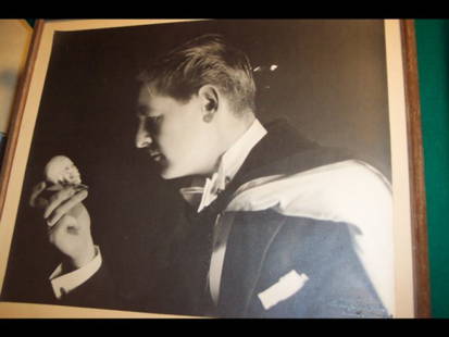 EARLY THEATRE PHOTOGRAPH (Hamlet) A black and white: EARLY THEATRE PHOTOGRAPH (Hamlet) A black and white vintage print studio portrait photograph of a young Billy in profile and formal wear, apparently posed as Shakespeare's "Hamlet;" the
