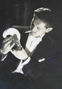 EARLY SIGNED & INSCRIBED MAGIC PHOTOGRAPH A black: EARLY SIGNED & INSCRIBED MAGIC PHOTOGRAPH A black and white vintage print studio portrait photograph of a young mustached Billy with a burning cigarette wearing elegant formal wear, holding a deck