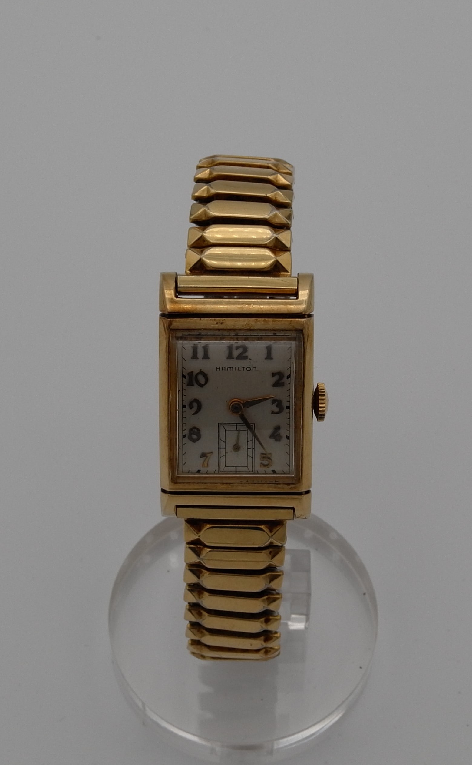 HAMILTON WATCH: HAMILTON Gold Filled men watch, circa 1950. Size: Case app. 22mm x 30mm rectangular, excluding crown. Condition: Working at the time of inspection. Please see pictures. Provenance: NYC prominent watch