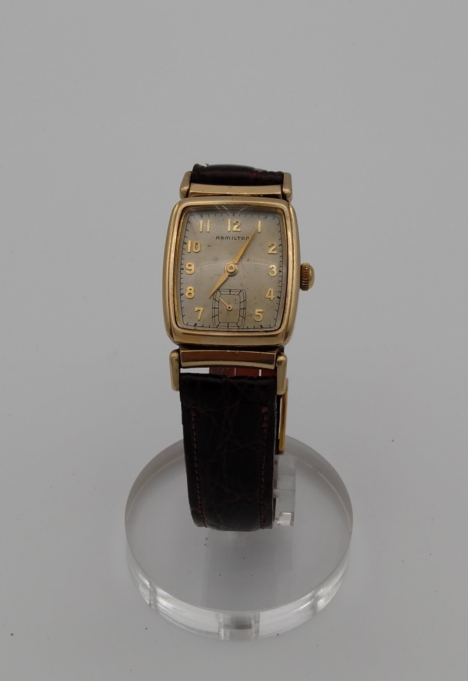 HAMILTON WATCH: HAMILTON GOLD FILLED men watch, circa 1950. Size: Case app. 24mm x 28mm rectangular, excluding crown. Condition: Working at the time of inspection. Please see pictures. Provenance: NYC prominent watch