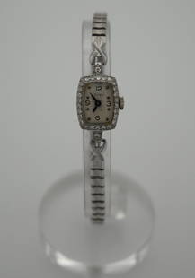 DOXA 14K GOLD AND DIMONDS MECHANICAL WOMEN WATCH: DOXA 14K GOLD AND DIMONDS MECHANICAL WOMEN WATCH, Circa 1940. Size: Case app. 14mm x 18mm excluding crown. Condition: Working at the time of inspection. Please see pictures. Provenance: NYC prominent