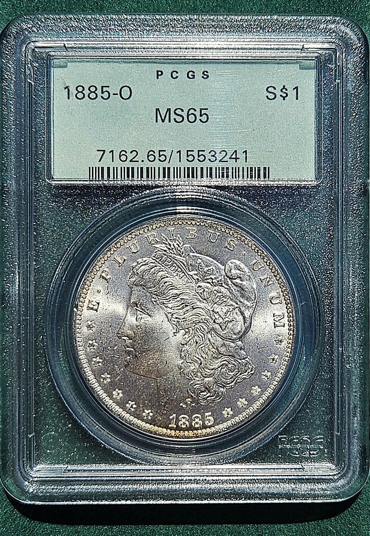 AMERICAN MORGAN ONE DOLLAR 1885-0 MS 65 PCGS CERTIGIED: AMERICAN MORGAN ONE DOLLAR 1885-0 MS 65 PCGS CERTIGIED. Size: Coin D 1 1/2 in. All measurements are approximate. Condition: Please see pictures. Provenance: NYC prominent watch collector. Note- Please