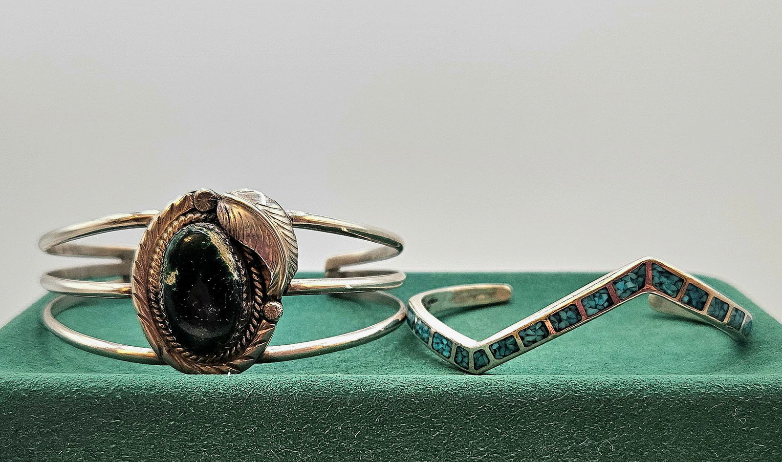 TWO DESIGNER NATIVE AMERICAN STERLING SILVER CUFF BRACELETS MALACHITE/ TURQUOISE: TWO DESIGNER NATIVE AMERICAN STERLING SILVER CUFF BRACELETS. One displays Mosaic Turquoise Cuff Bracelet, Second one displays Malachite Center Stone. Size:1 - 2 1/4 x 1 3/4 in.; 2 - 2 1/2 x 2. All mea