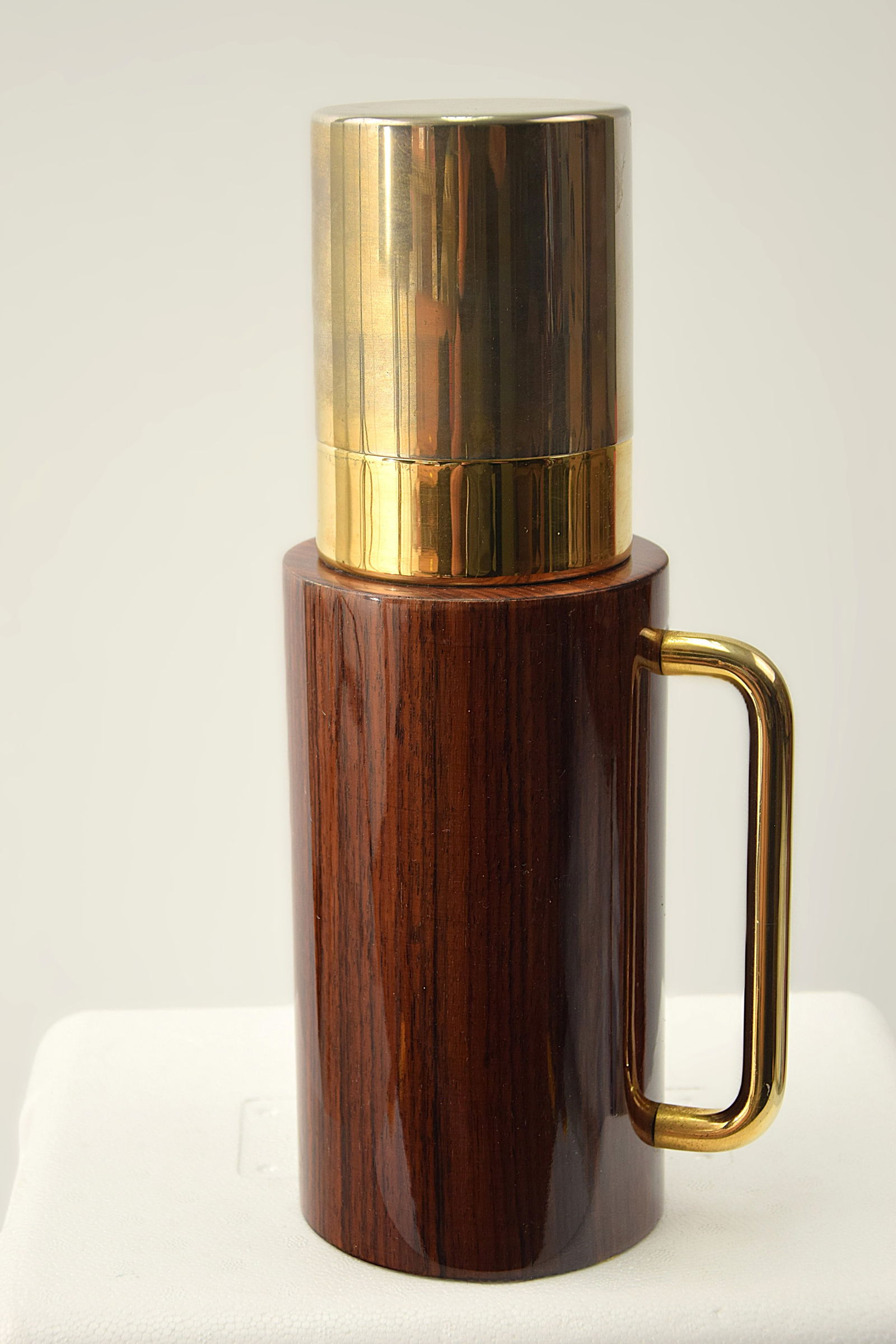 MID - CENTURY MODERN ALDO TURA ITALIAN COCKTAIL SHAKER: MID - CENTURY MODERN ALDO TURA ITALIAN COCKTAIL SHAKER. ALDO TURA (1909-1963), an Italian Designer. C. 1950-1960s., made from Brass and Wood Veneer. On the base label "CREAZIONE TURA ITALY". VINTAGE T